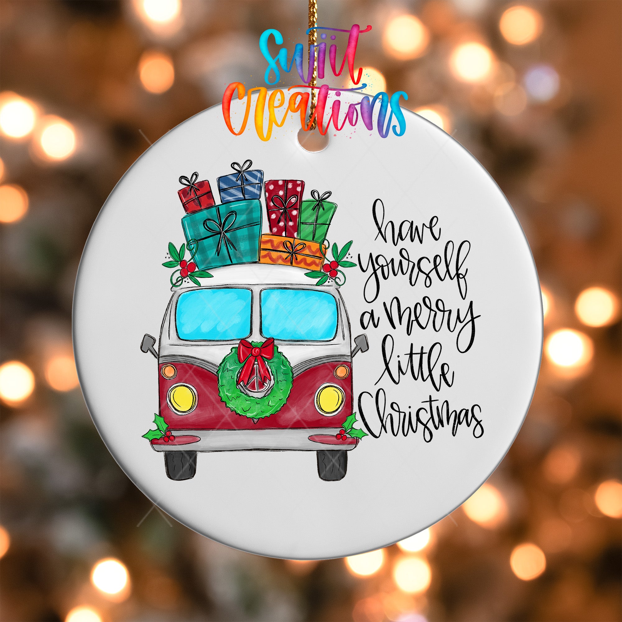 A white ornament with a red and white van decorated with Christmas presents and a wreath, along with the text "Have yourself a merry little Christmas" written on it.