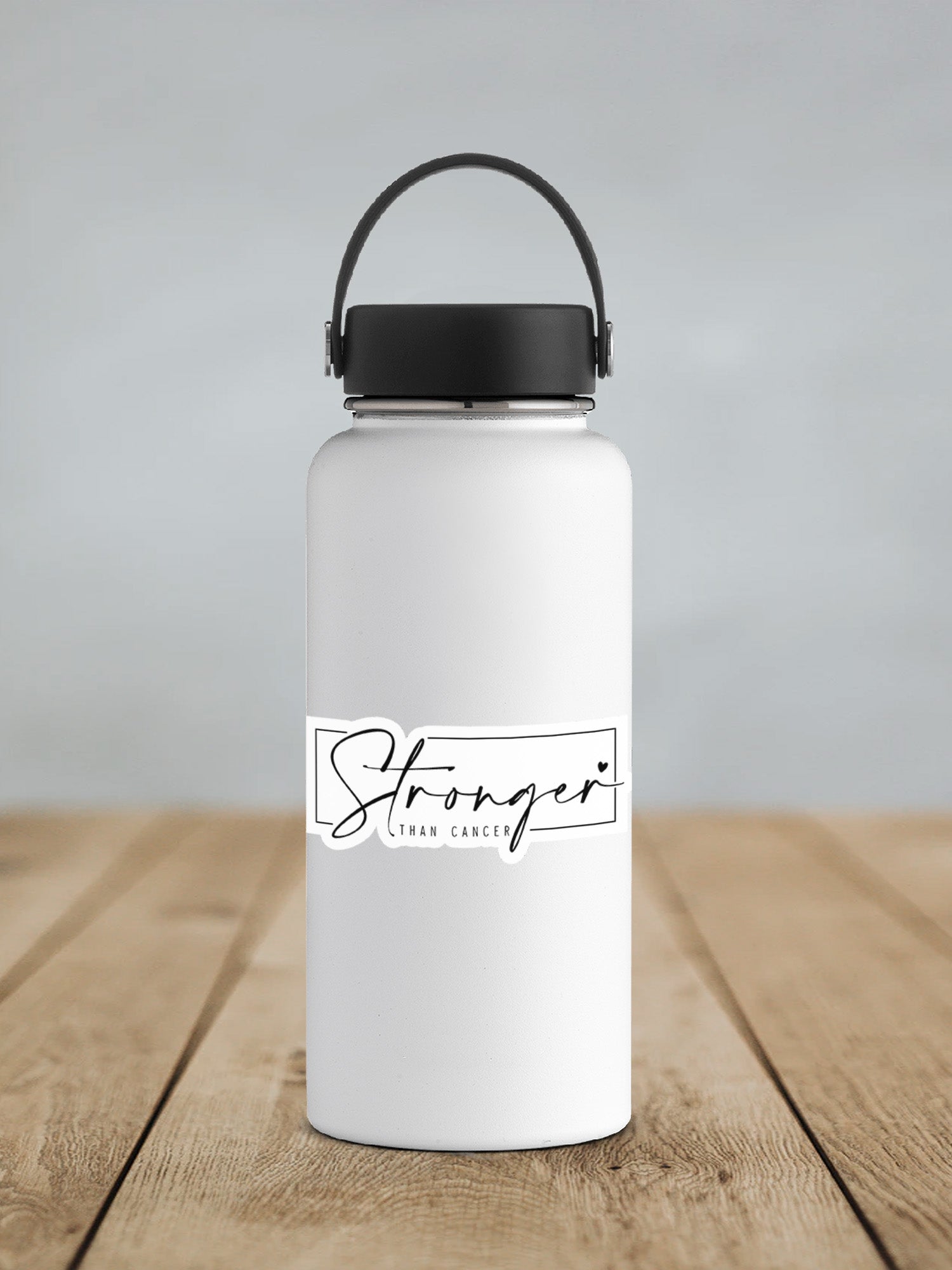 a white water bottle sitting on top of a wooden table