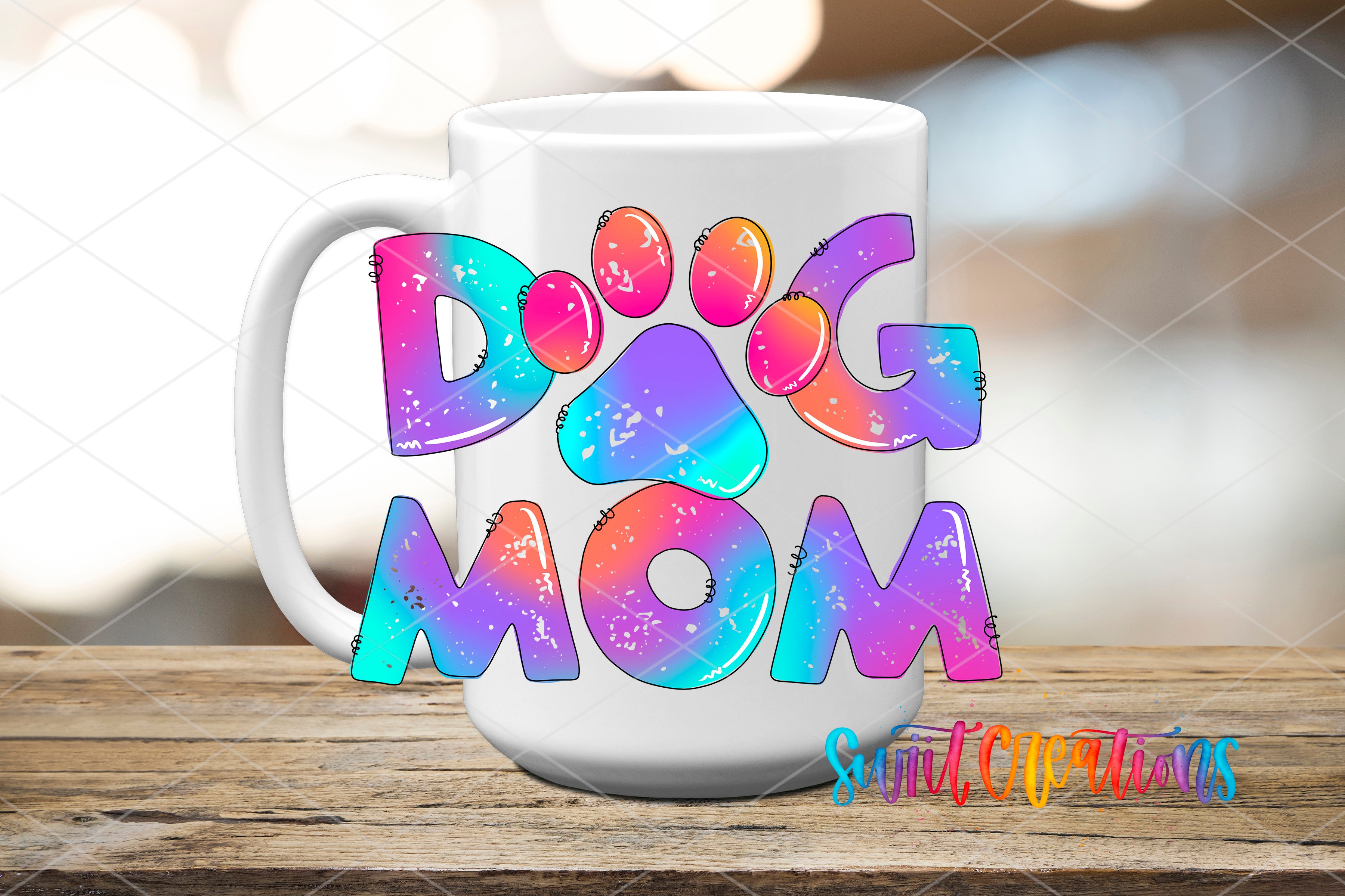 A white mug with colorful text that says "DOG MOM" on it.