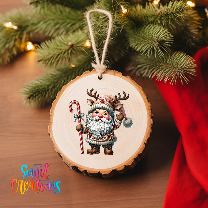 A wooden ornament featuring a cartoon Santa Claus holding a candy cane and reindeer, hanging on a Christmas tree.