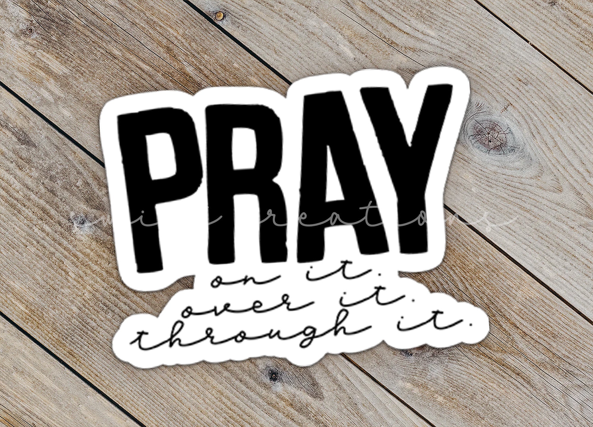 a sticker with the words pray on it