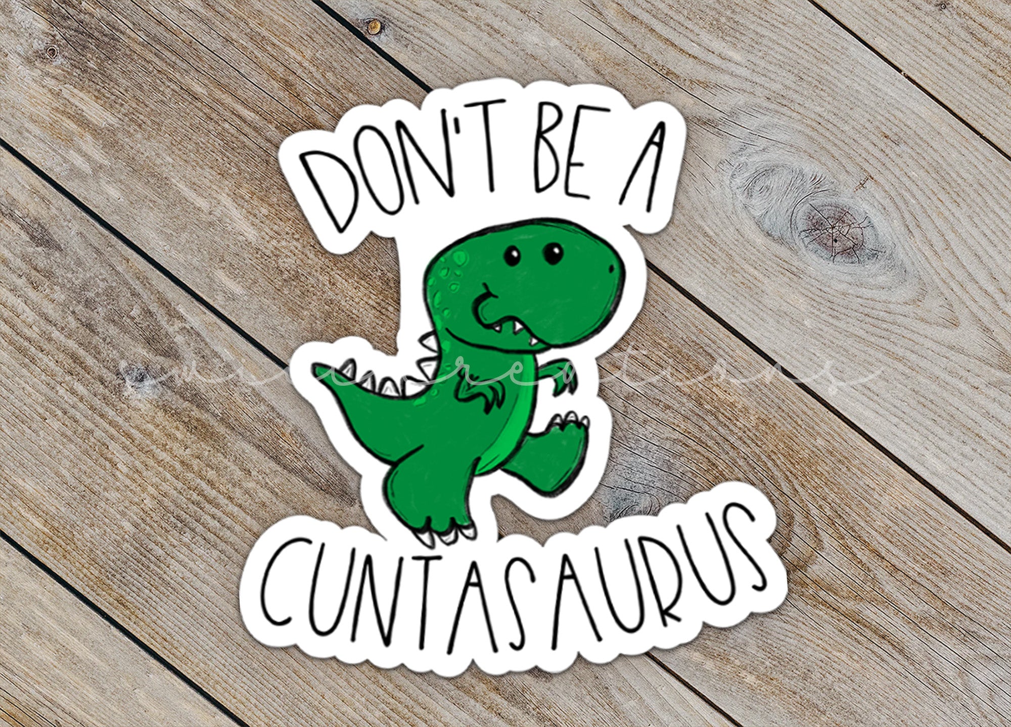 a sticker that says don't be a dinosaur