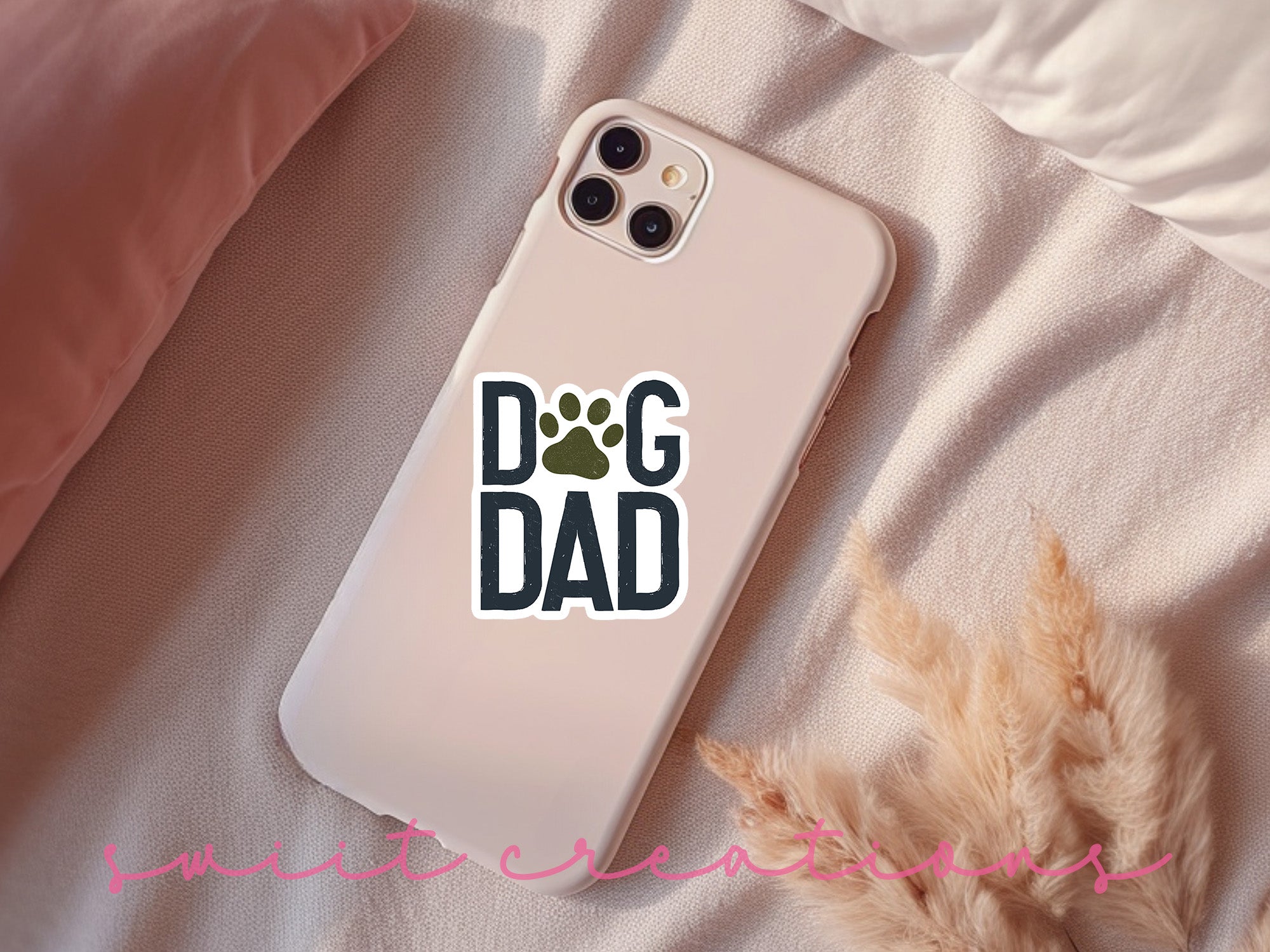 a phone case with a dog dad sticker on it