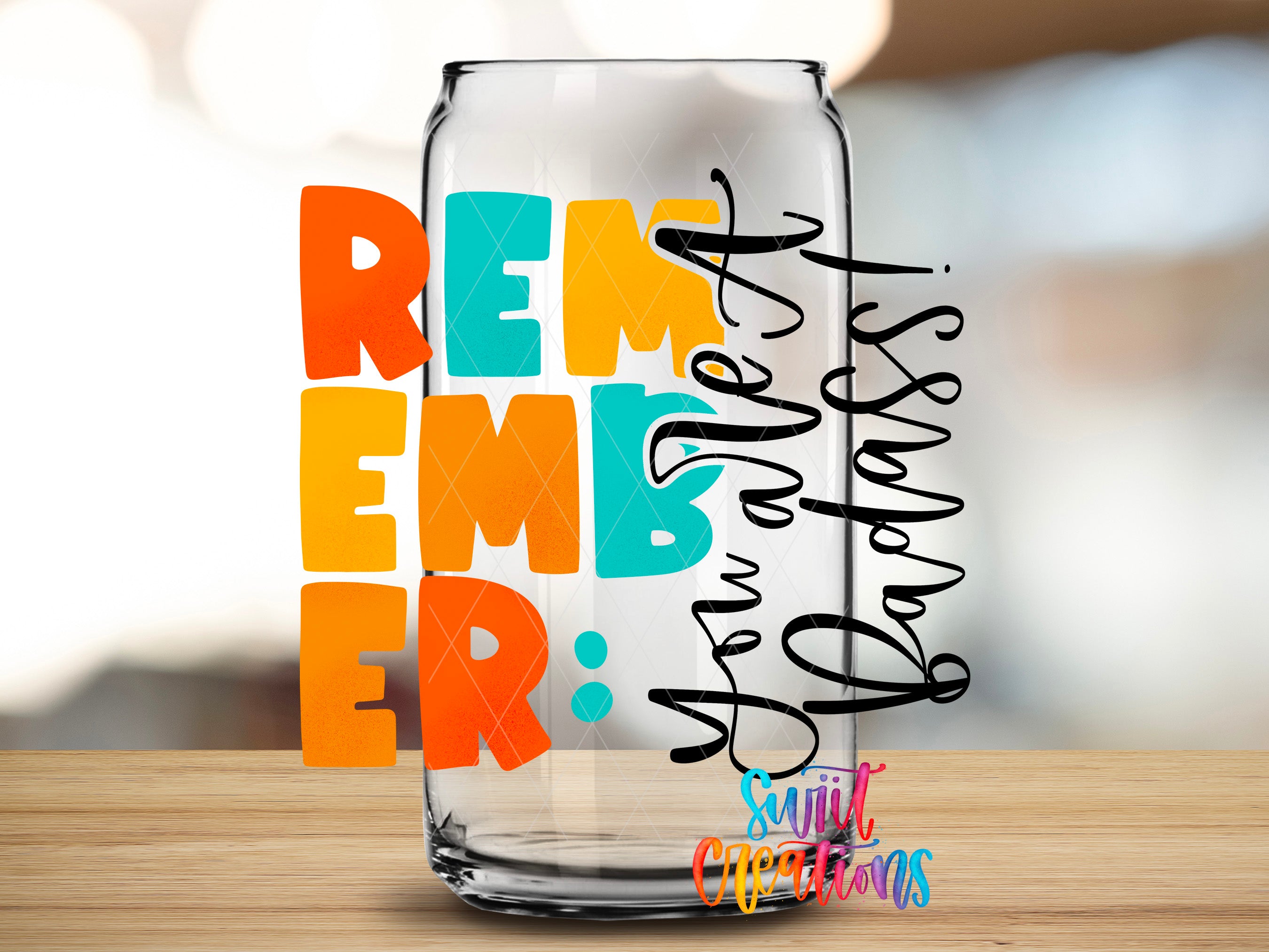 a glass can with a colorful design and text on it.