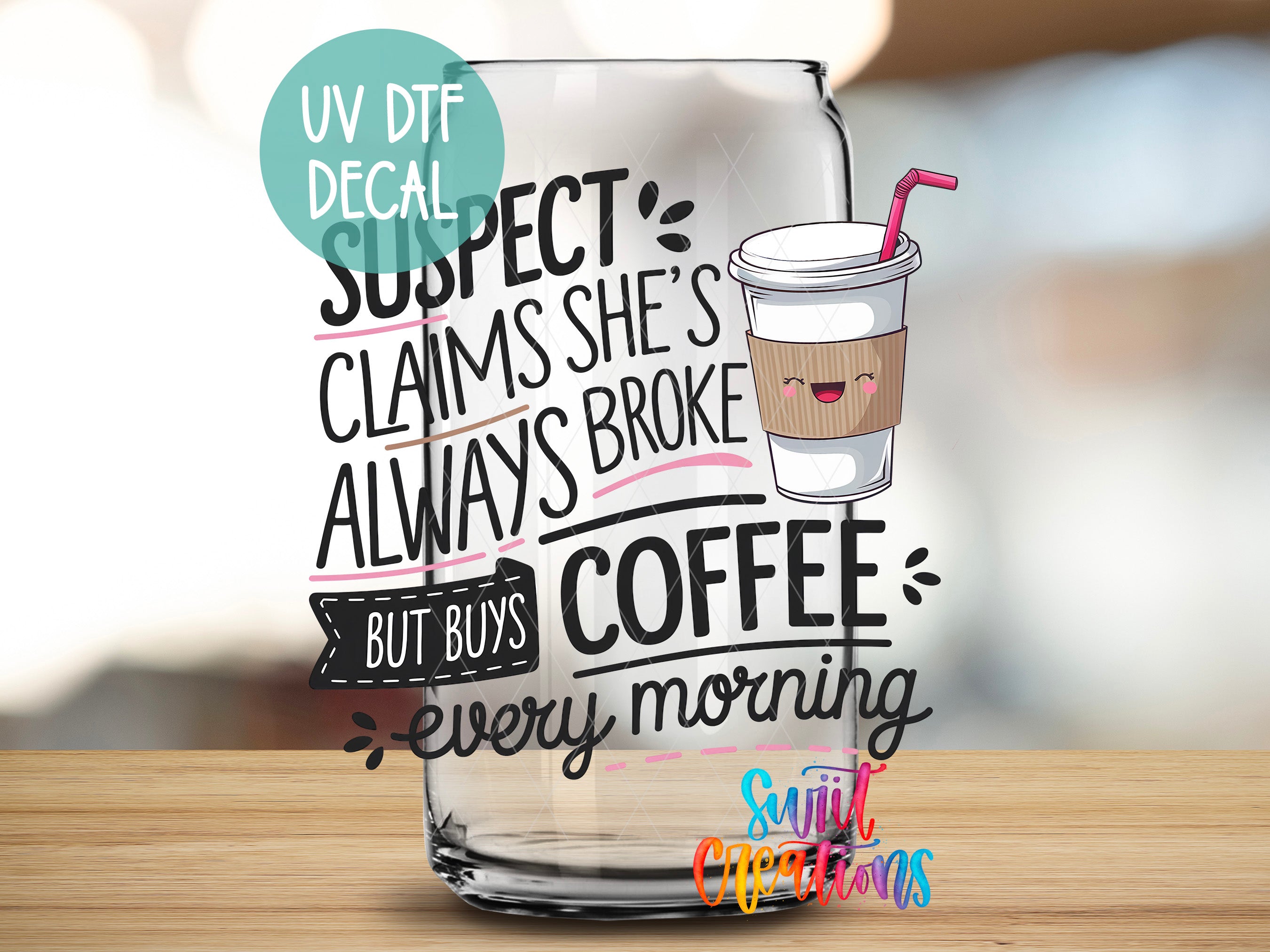 a glass with a drink inside of it on a table