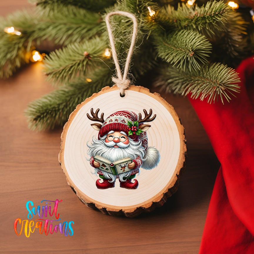 A wooden ornament featuring a cartoon Santa Claus character is hanging on a Christmas tree.