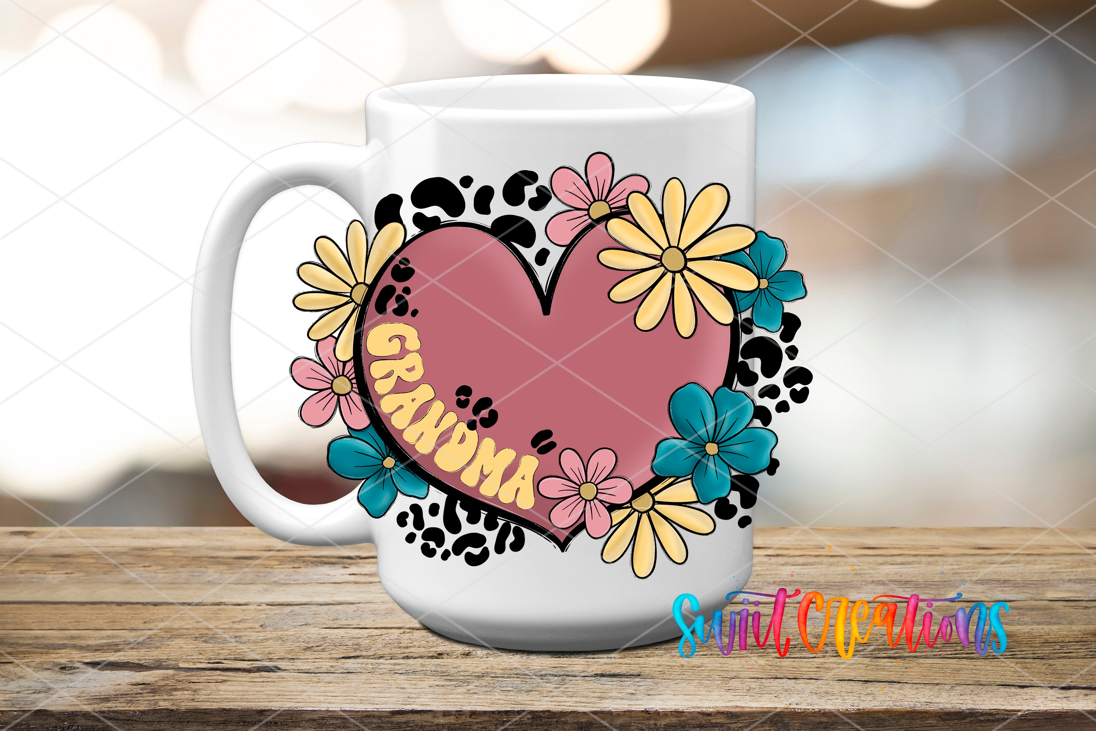 A white ceramic mug with a heart-shaped design featuring colorful flowers and the word "Grandma" written on it.