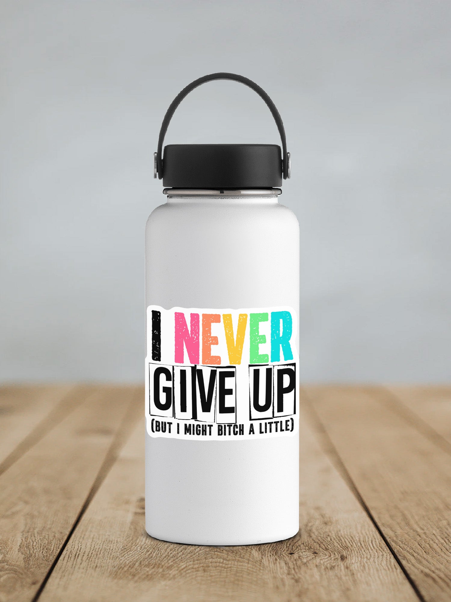 a white water bottle sitting on top of a wooden table