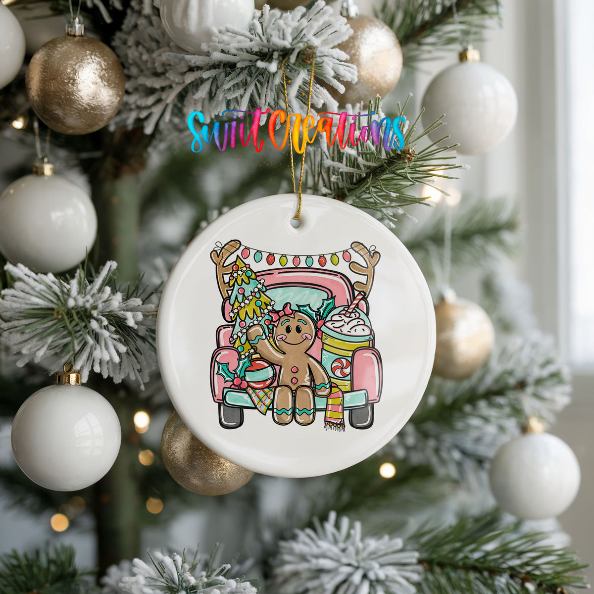 A Christmas tree decorated with ornaments, including a white ornament with a gingerbread man design hanging from a tree branch.