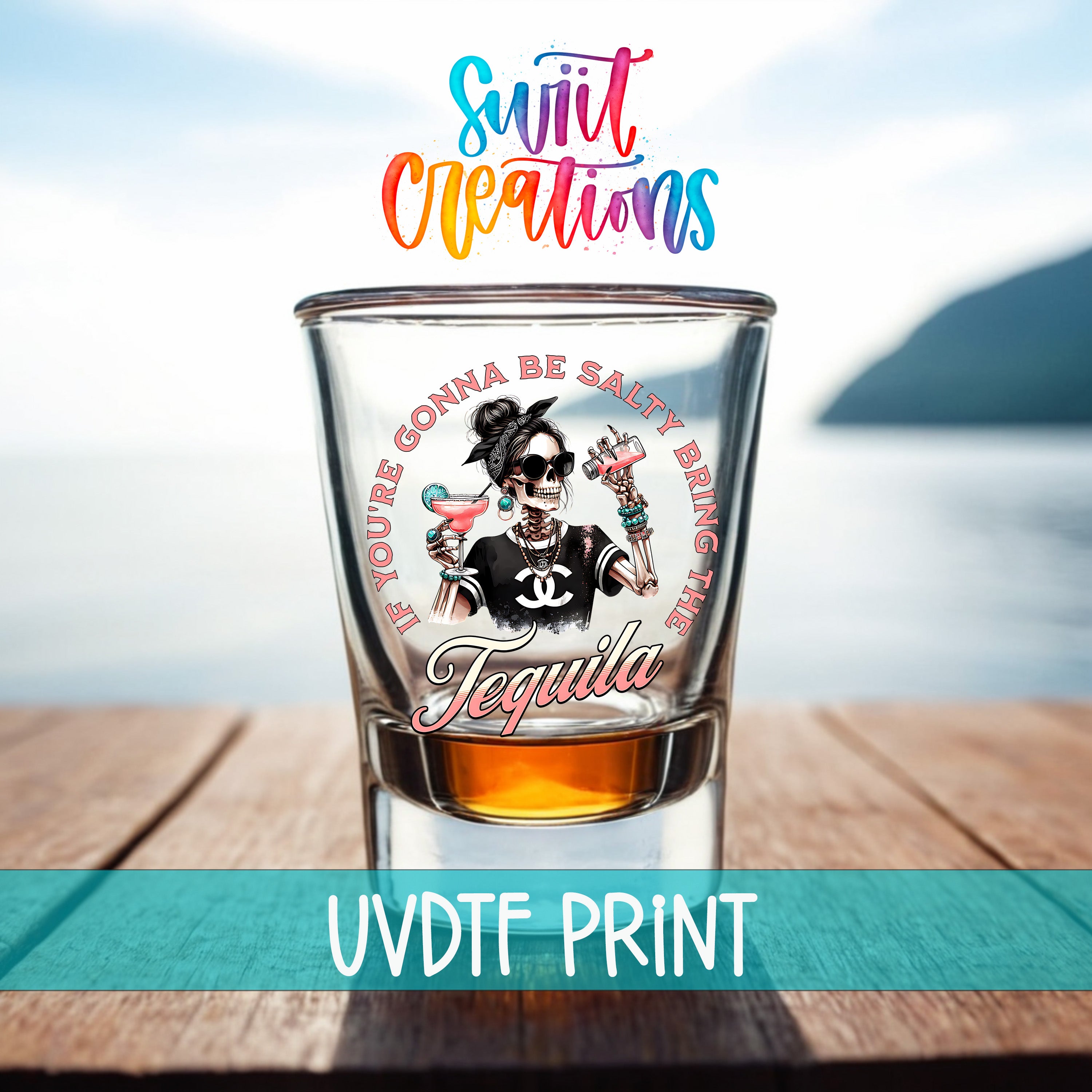 A shot glass with a graphic design featuring a woman with a skull-like face and the text "If you're gonna be salty bring the tequila" printed on it.