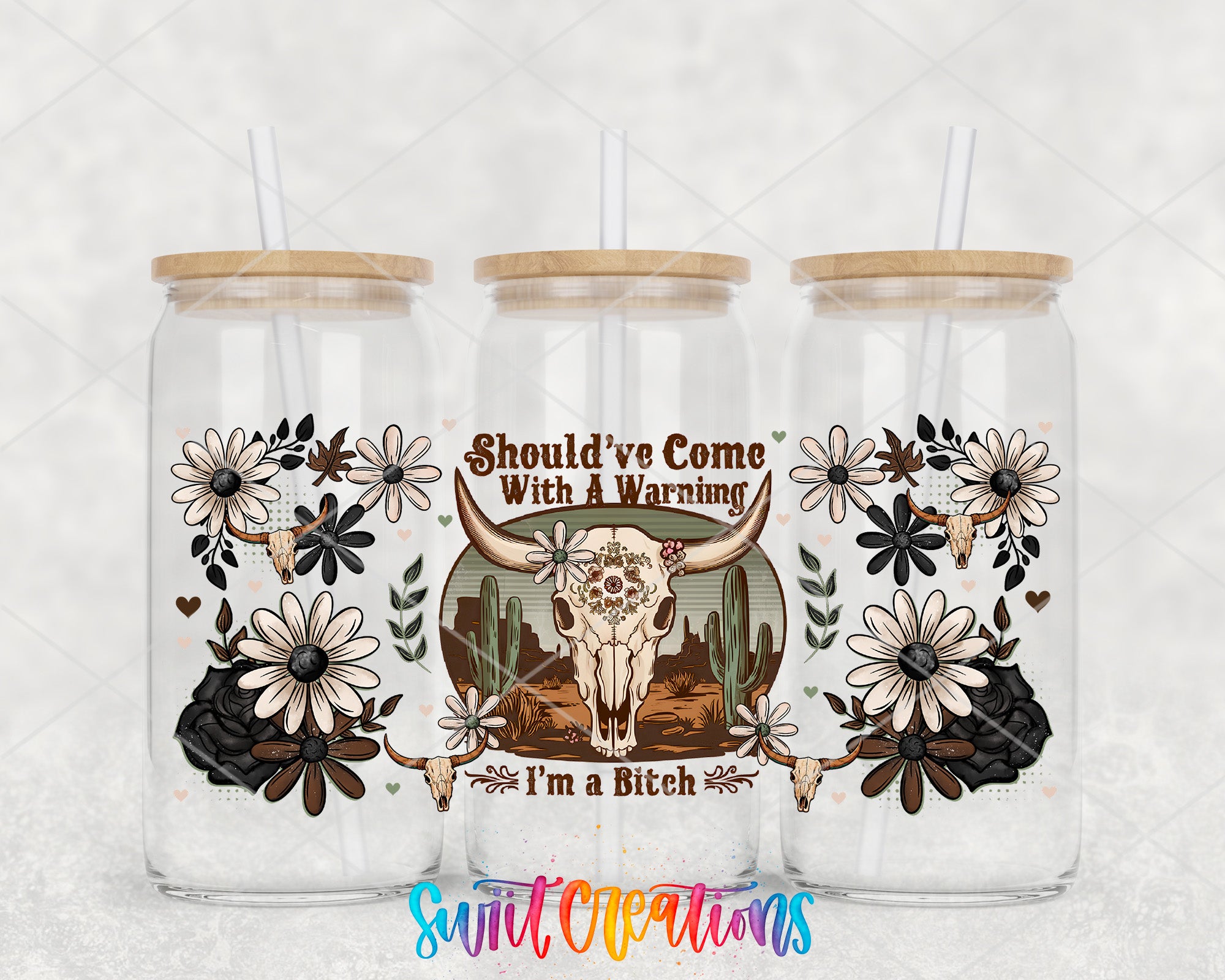 three glass tumblers with floral and skull designs, along with straws. The text on the tumblers reads "SHOULD'VE COME WITH A WARMING I'M A BITCH".