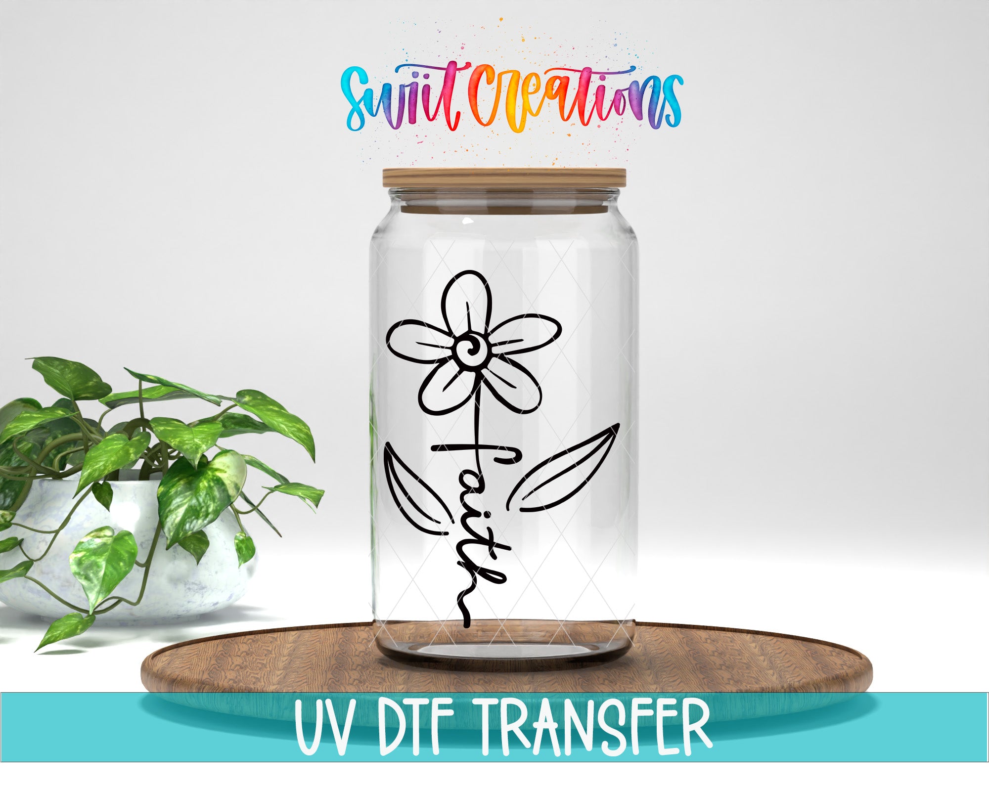 A clear glass jar with a flower design and the word "Faith" written on it, placed on a wooden surface.