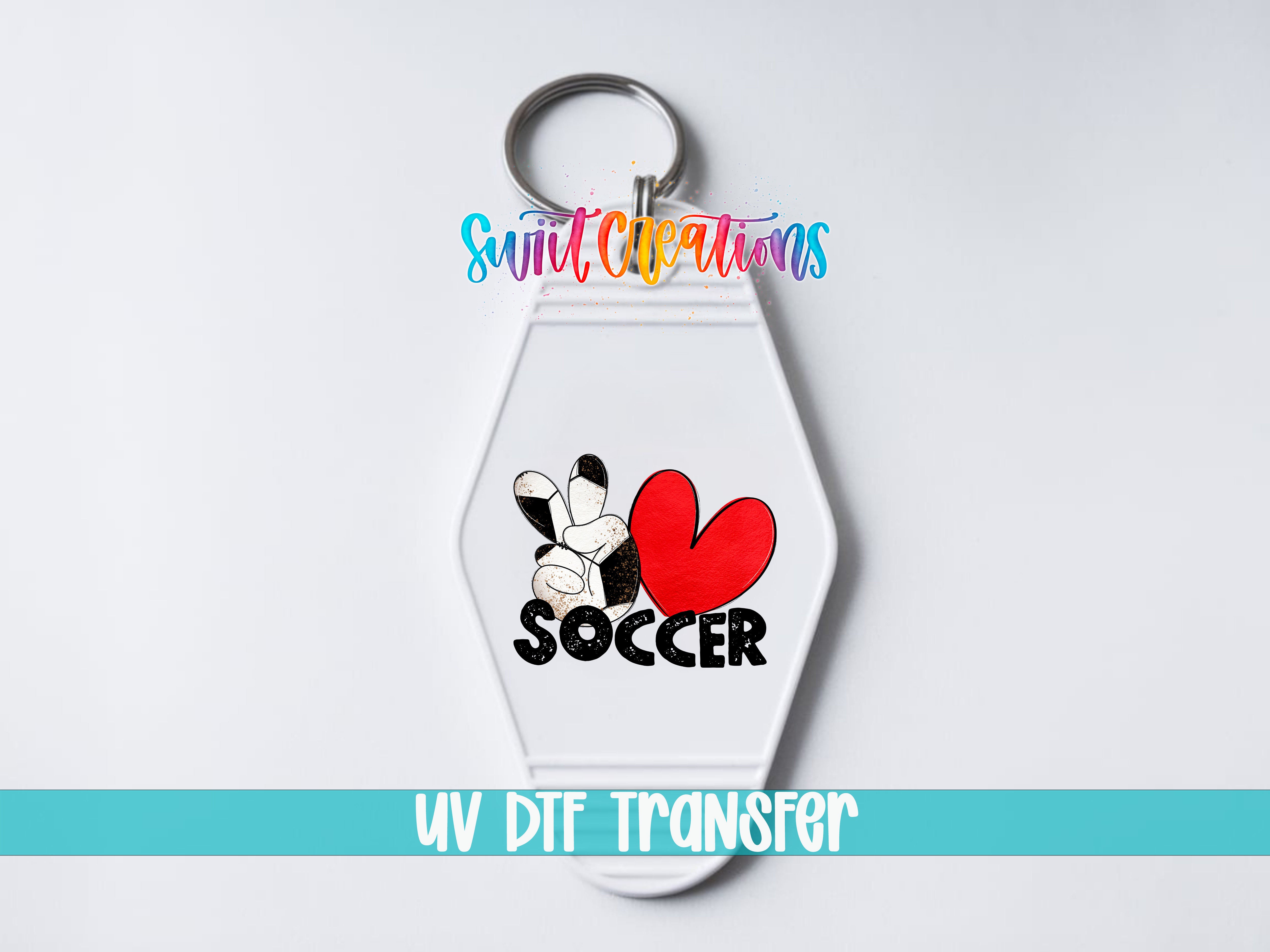 A white keychain with a colorful design featuring a soccer ball and the word "SOCCER" printed on it.