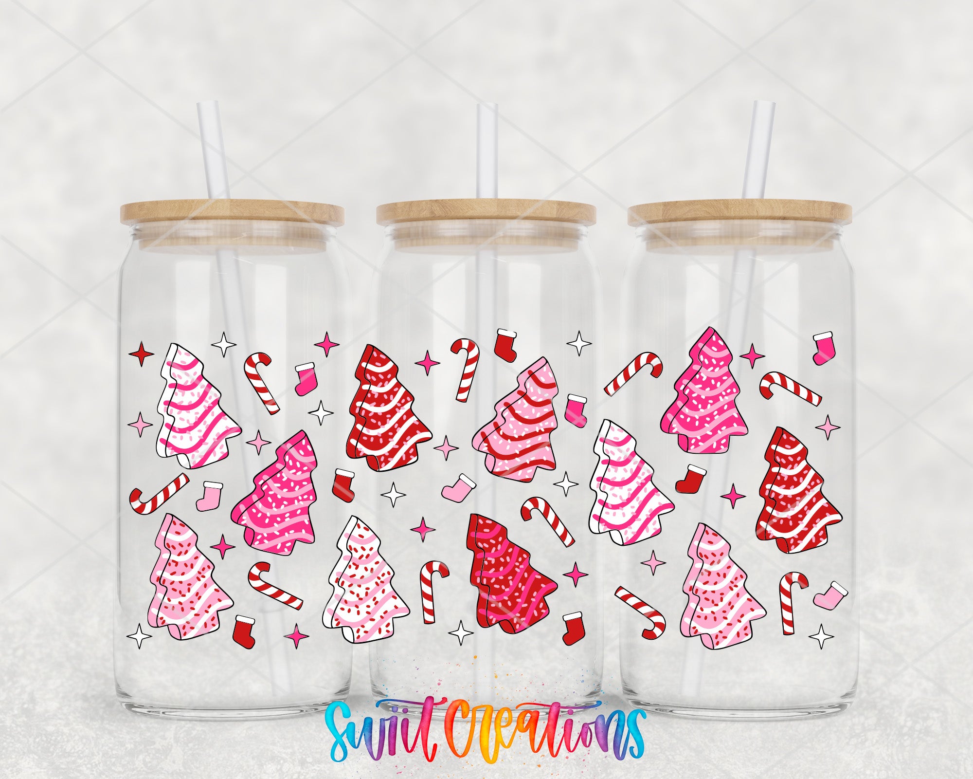 Three glass tumblers with a festive Christmas tree and candy cane design printed on them.