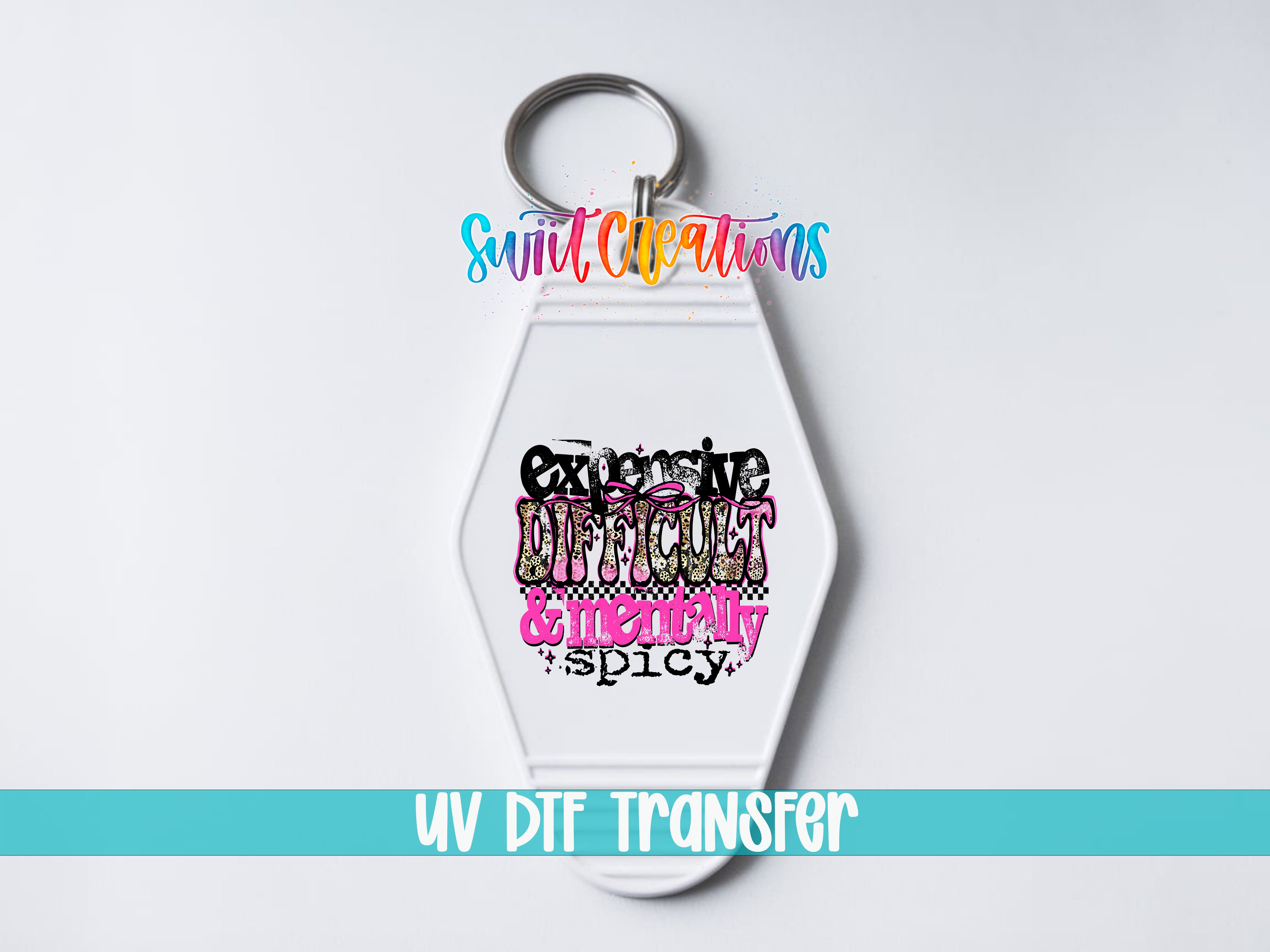A keychain with a colorful design featuring the text "Excessive Difficulty & Emotional Spicy" in a stylized font.