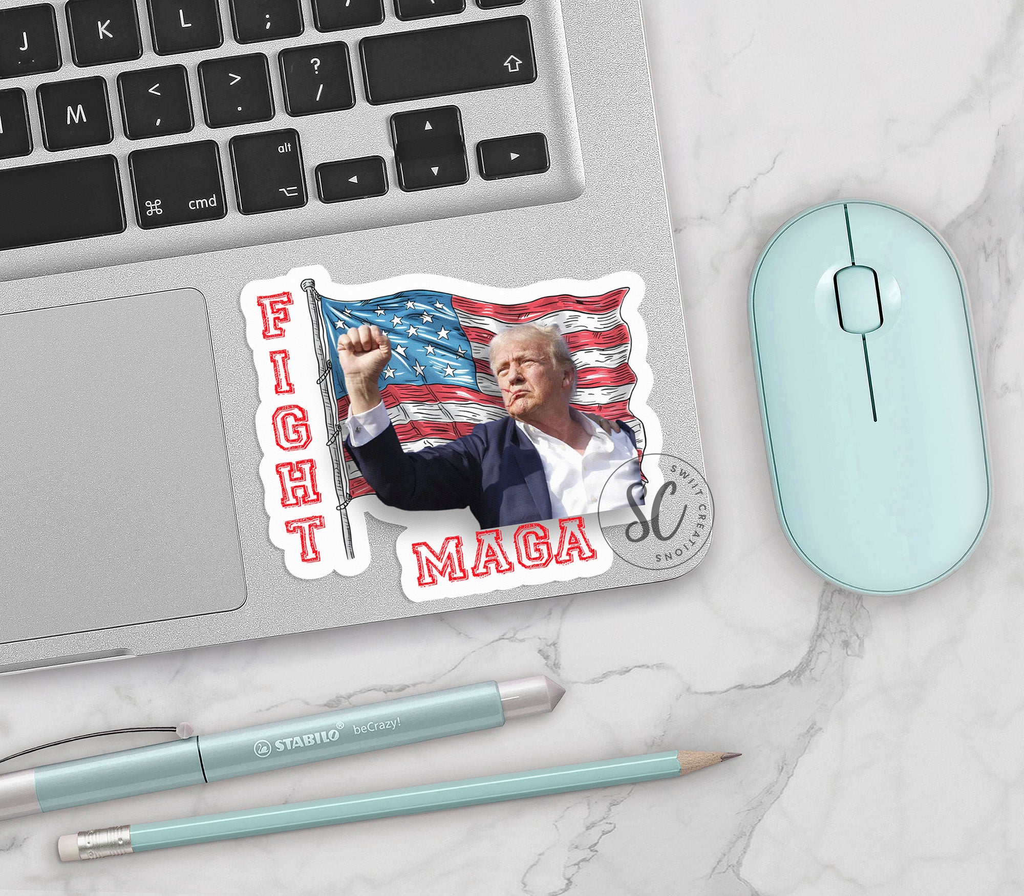 a mouse, keyboard, and sticker on a desk