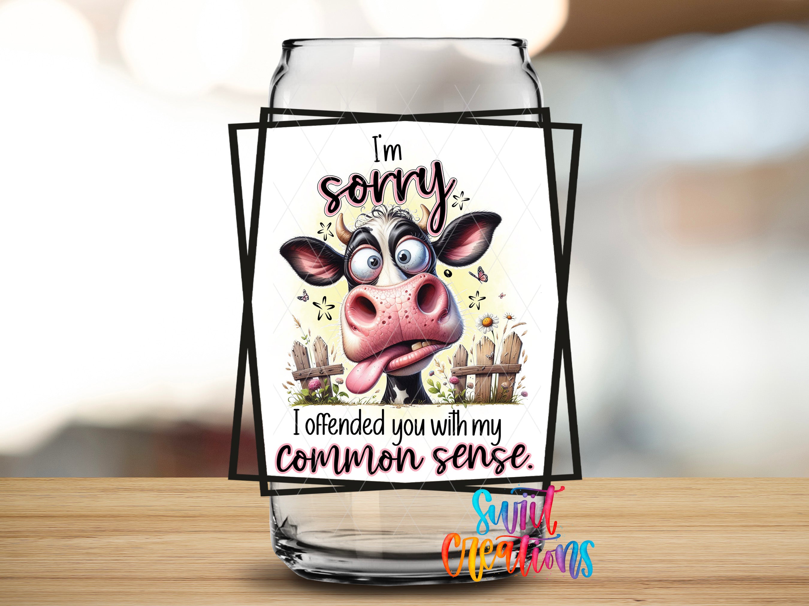 a humorous cow sticker on a glass jar, with the text "I'm sorry, I offended you with my common sense" displayed prominently.
