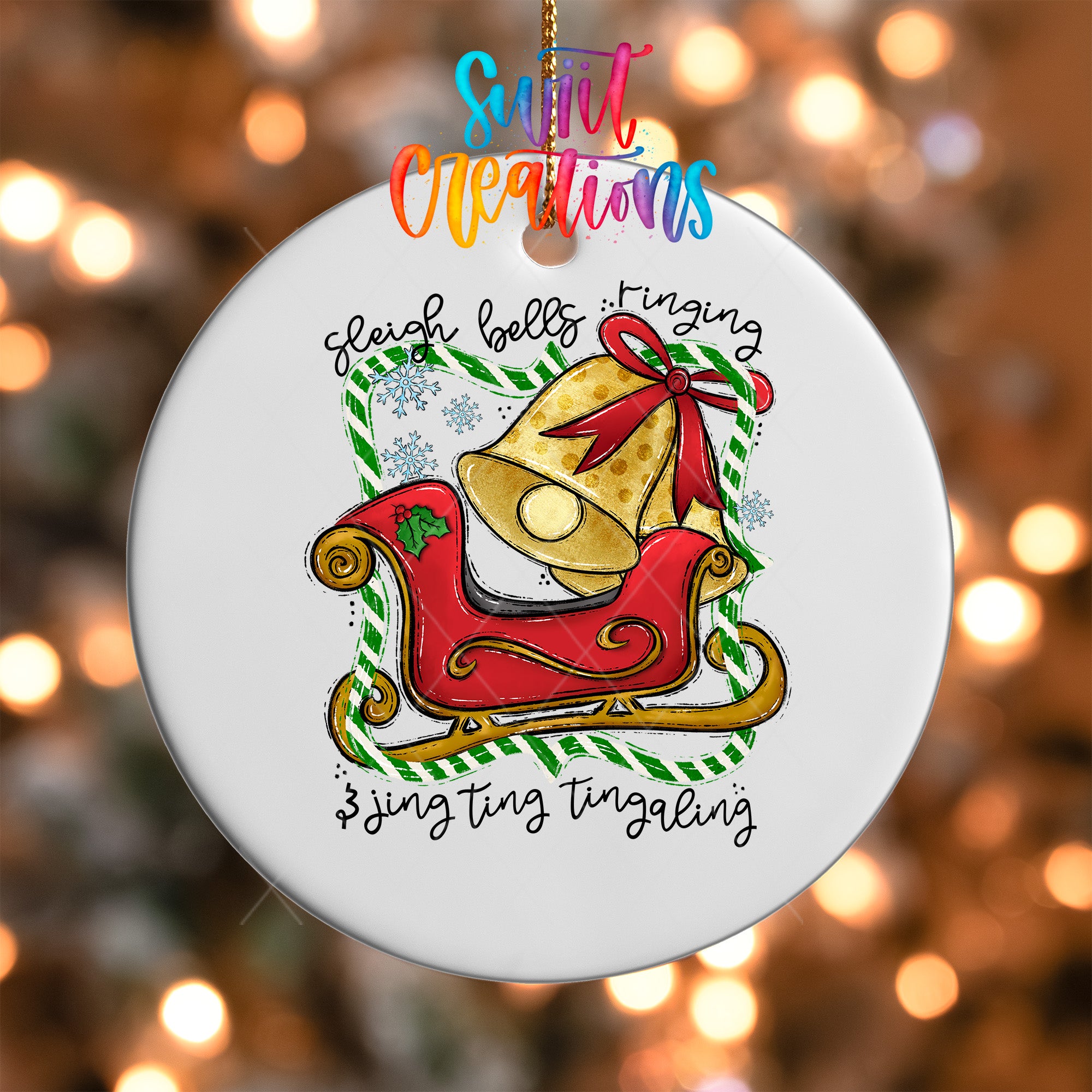 A white ornament with a red sleigh and a bell, surrounded by snowflakes and text that reads "Sleeping bells ringing".