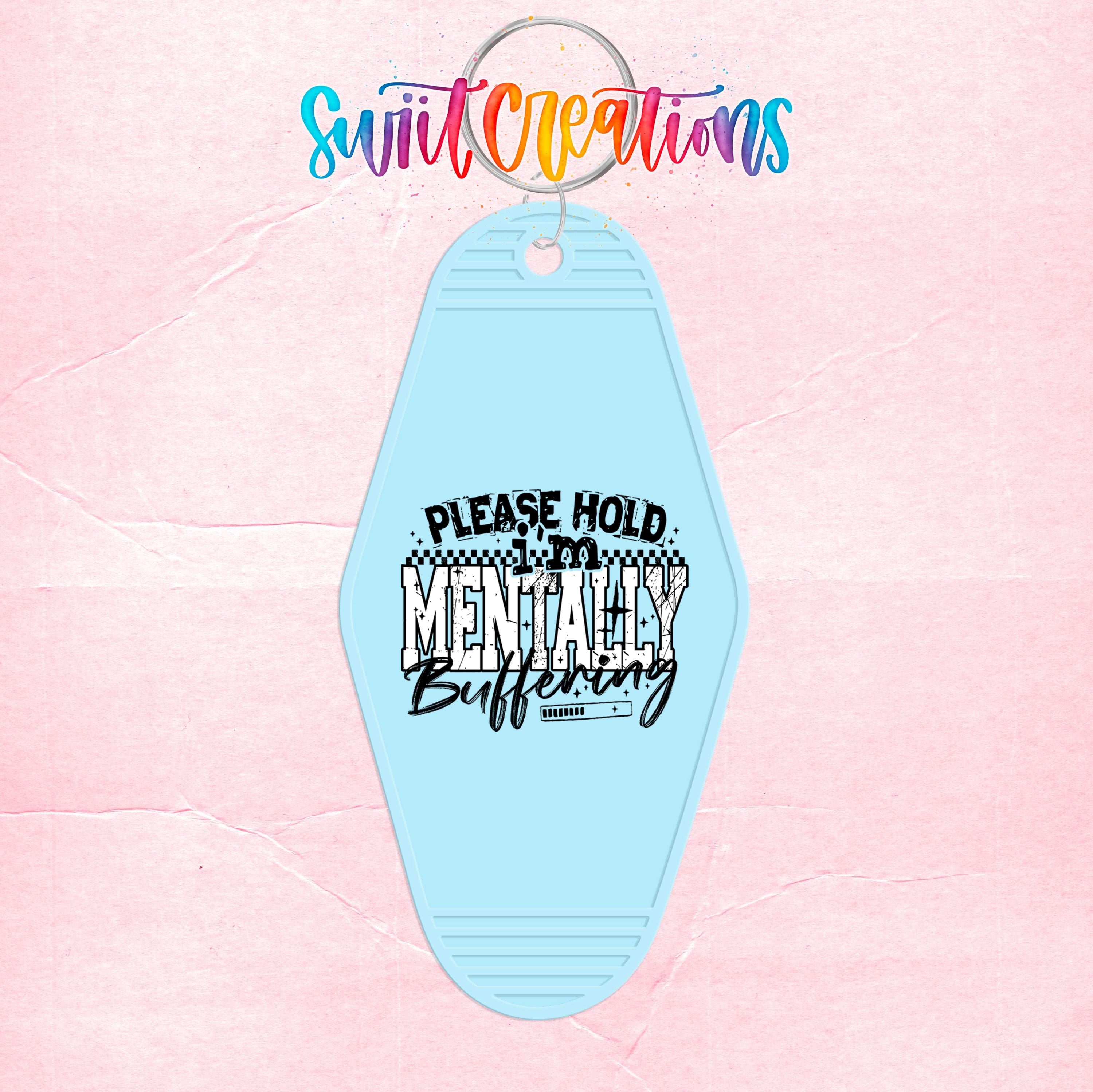 A keychain with a light blue color and a message printed on it.