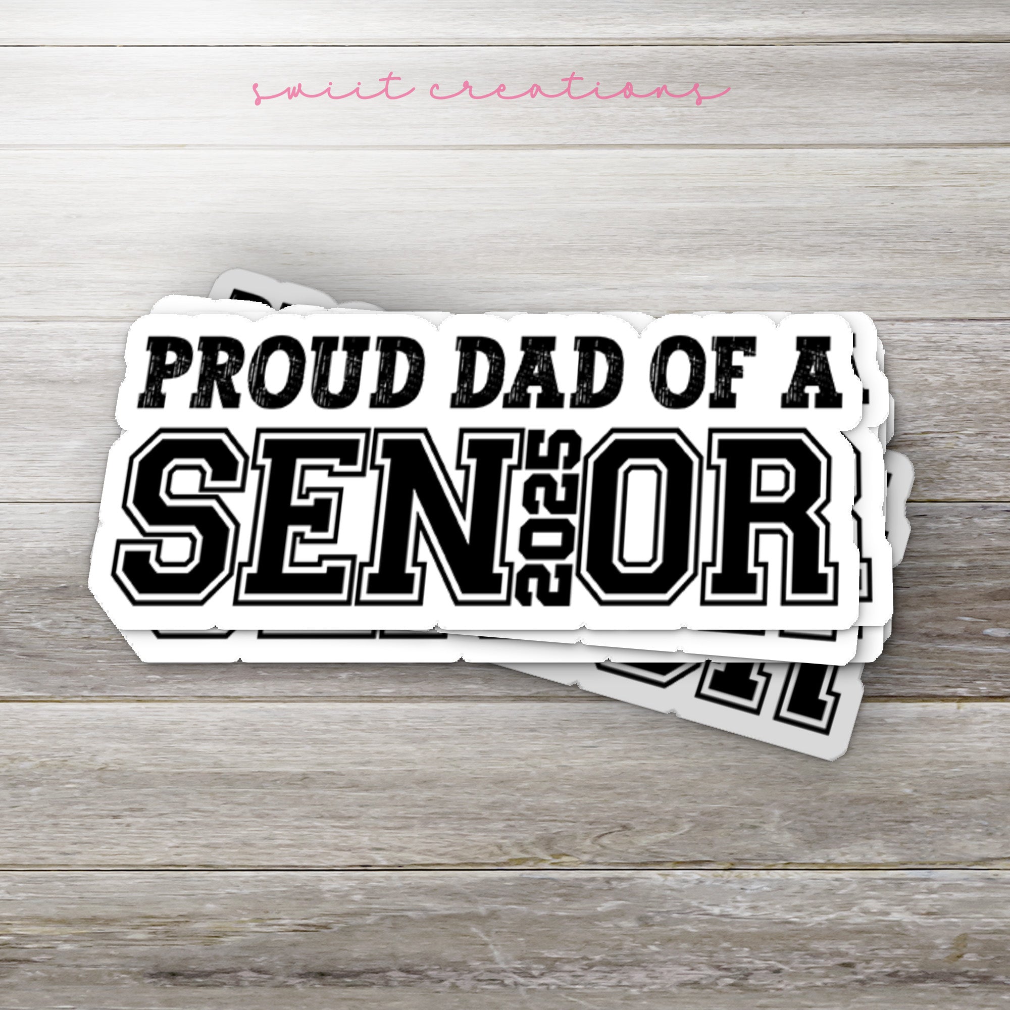 two stickers that say proud dad of a senior