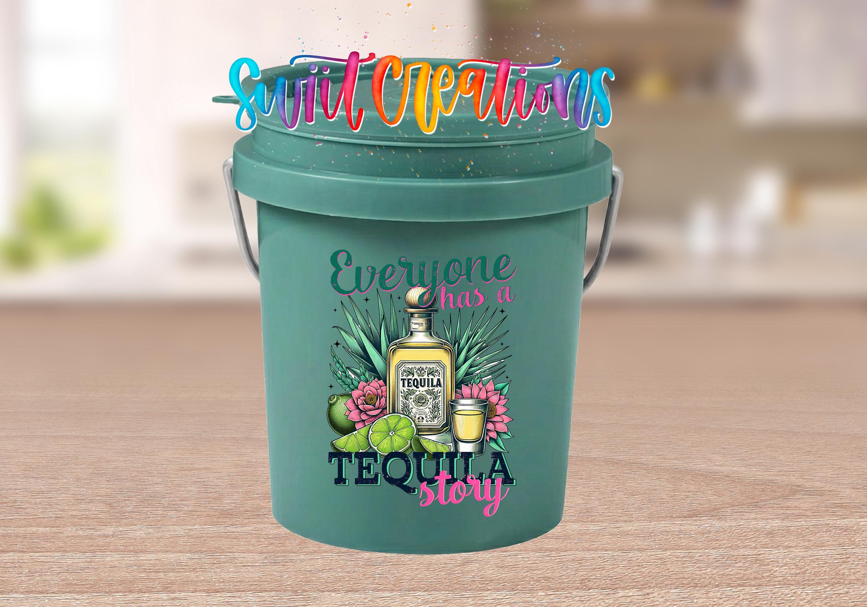 A green bucket with a colorful design featuring a tequila bottle, lime, and other tropical elements, along with the text "Everyone has a TEQUILA story".