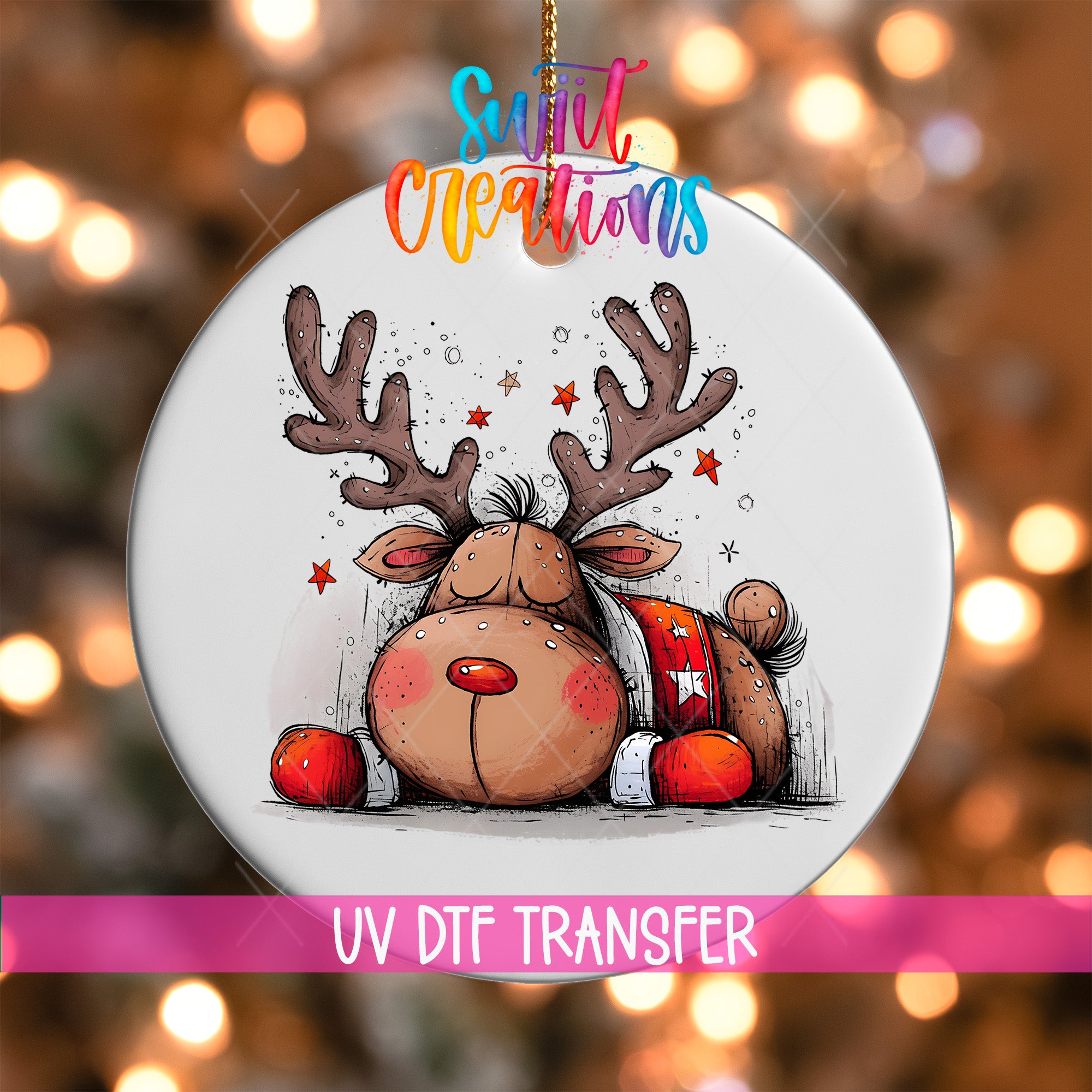 A white ornament with a cartoon reindeer and Christmas decorations, including red and white ornaments, is hanging against a background of colorful lights.