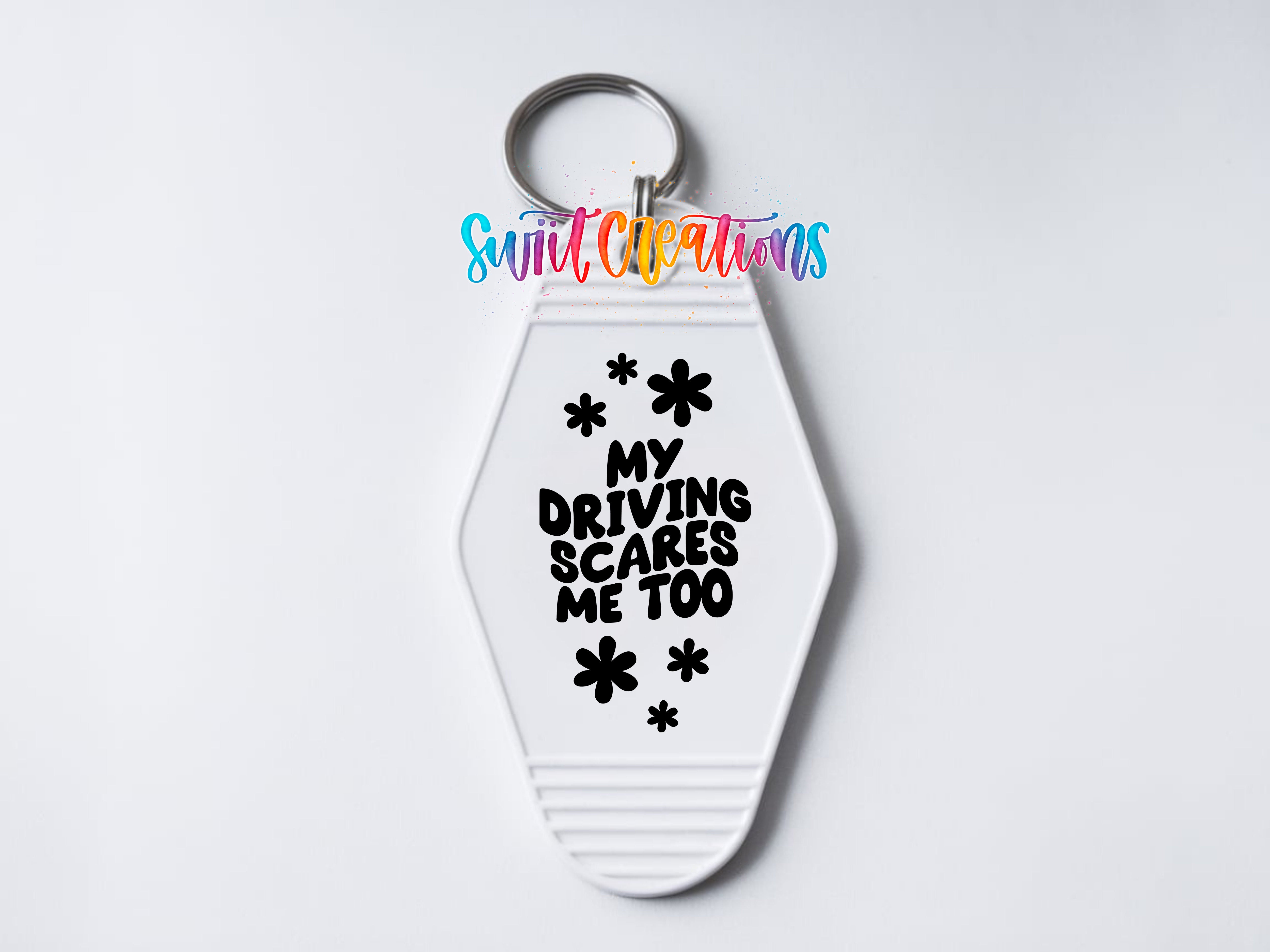 A keychain with a keyring and a printed message on it.