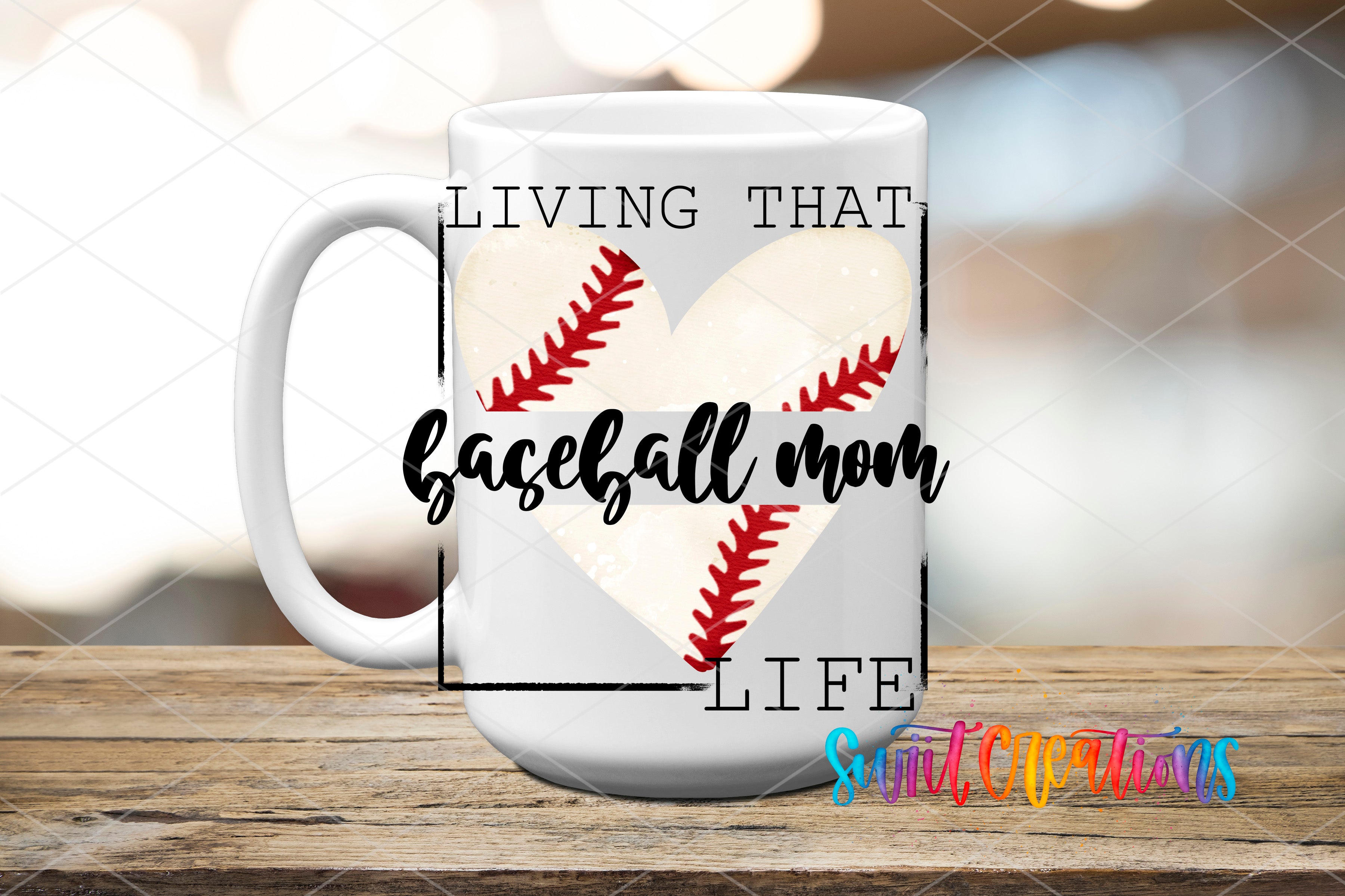 A white mug with a baseball design and text that says "LIVING THAT BASEBALL MOM LIFE" printed on it.