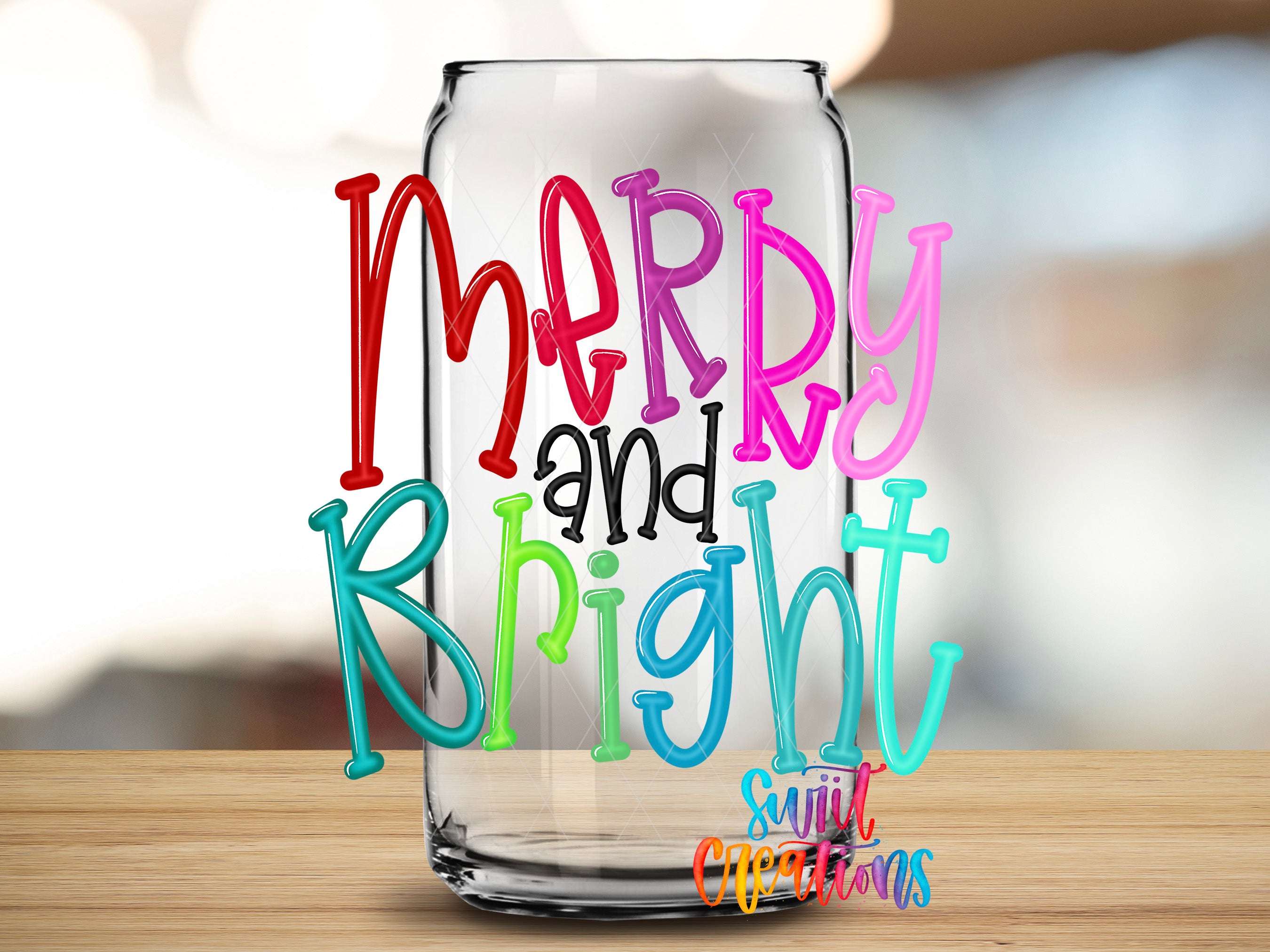 a clear glass jar with colorful text on it, placed on a wooden surface.