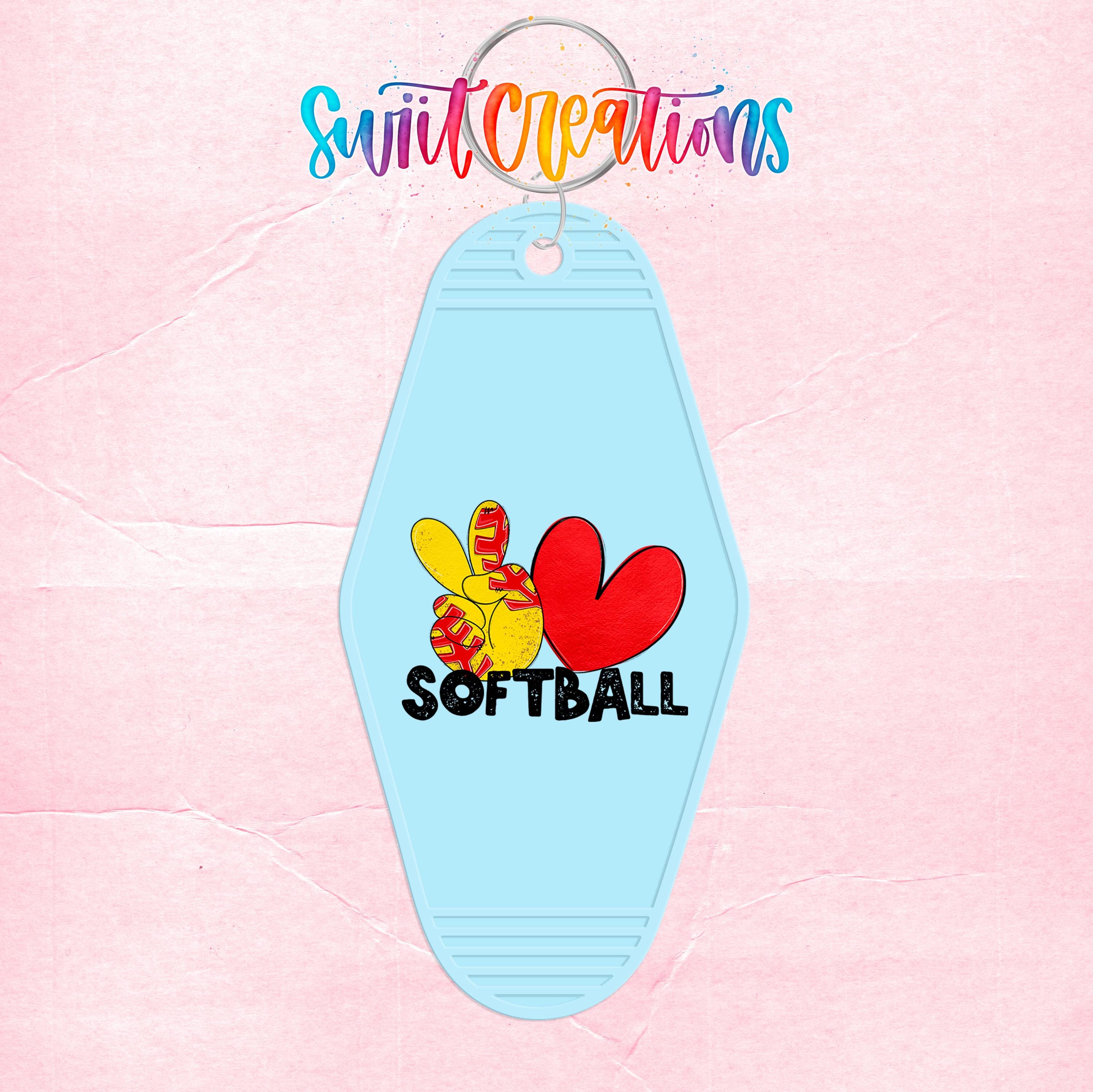 A keychain with a light blue shape and a design featuring a red heart, a peace sign, and the word "SOFTBALL".