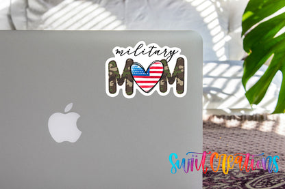 a sticker with the text "Military Mom" and an American flag design on the back of a laptop.