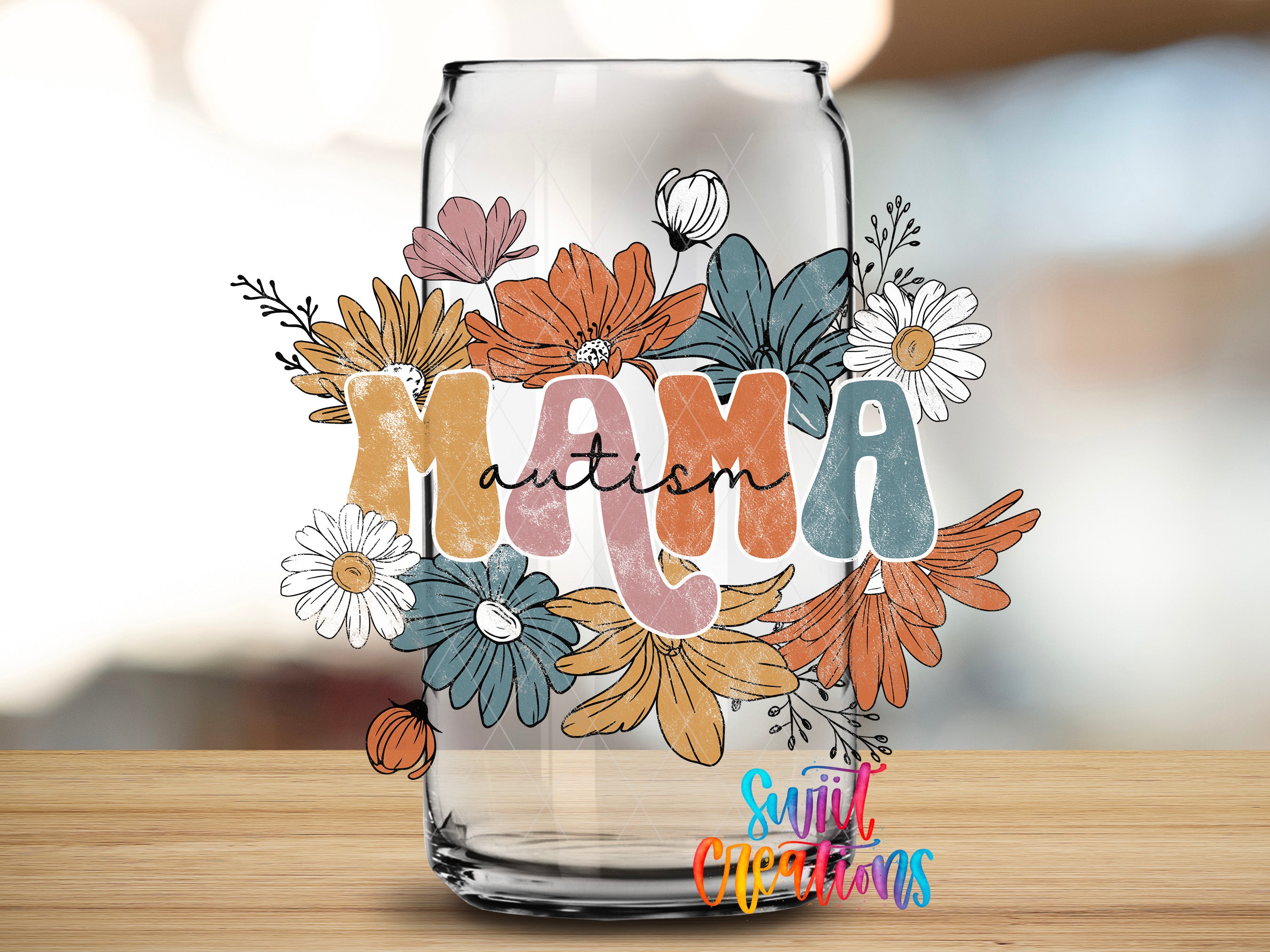a glass jar with a colorful floral design and the word "Autism" written on it.