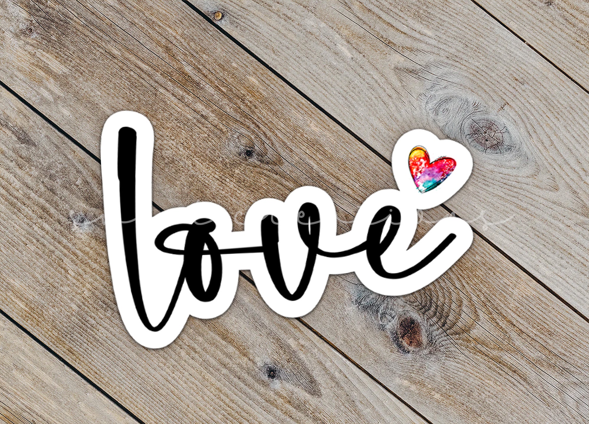 a sticker that says love with a heart on it