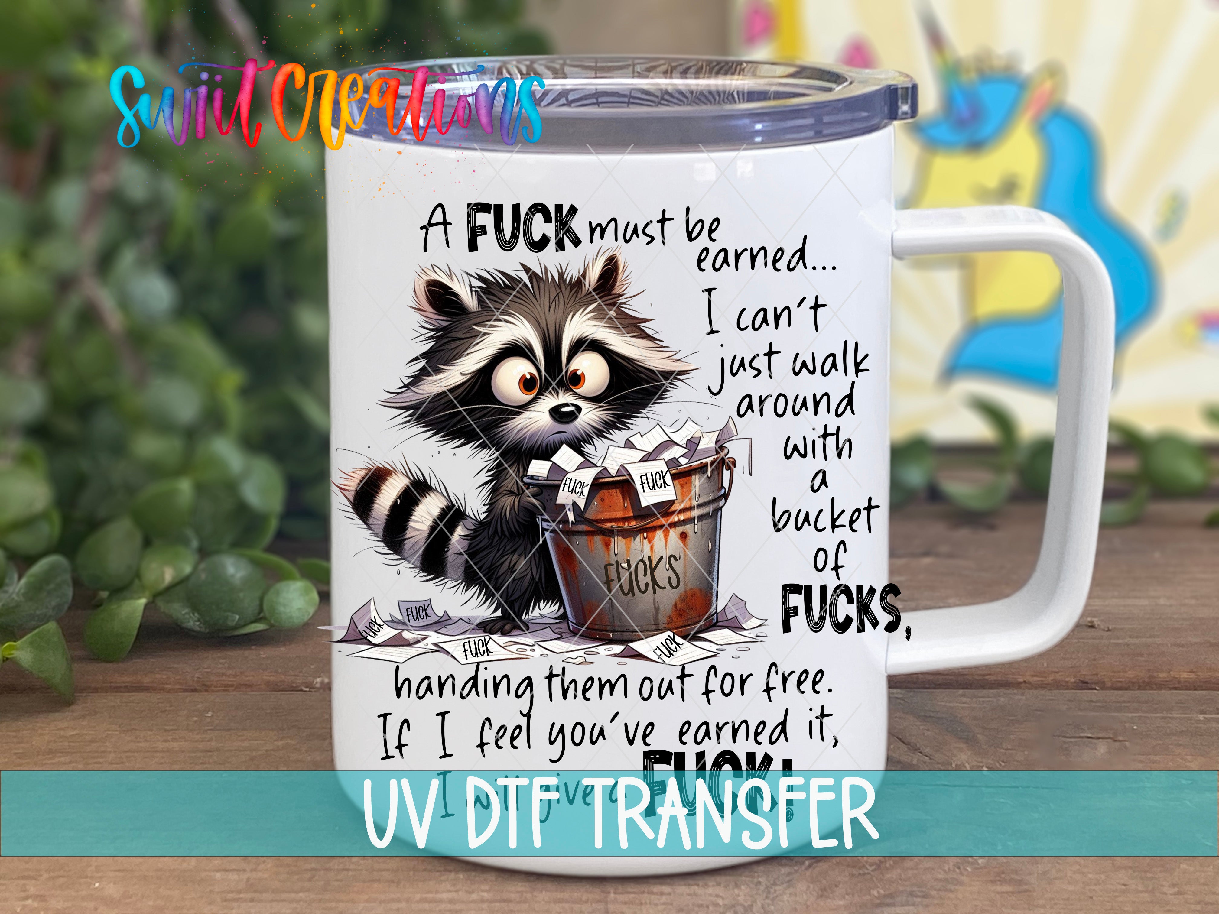 A mug with a raccoon and text on it, along with a background of colorful, abstract shapes.