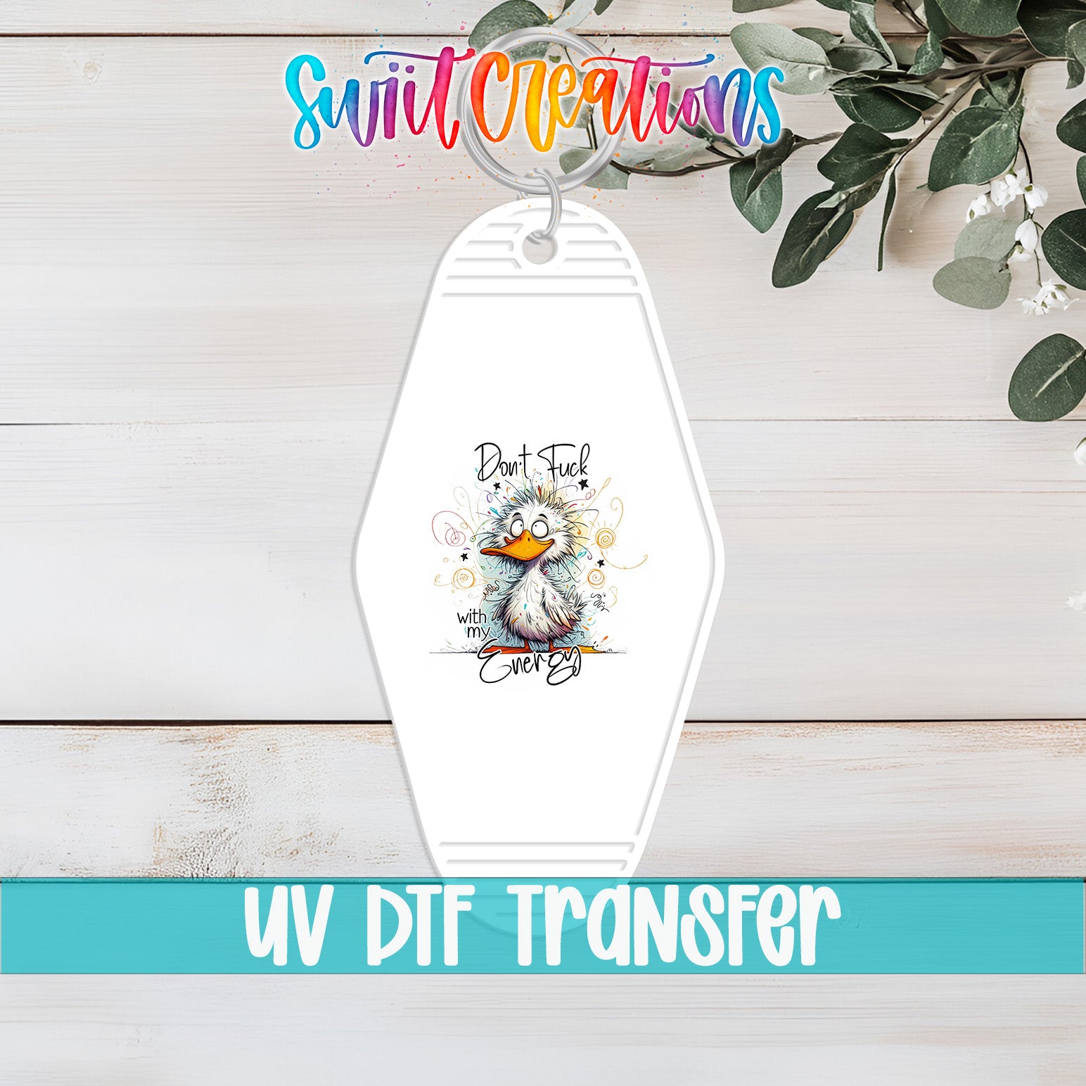 A keychain with a cartoon duck and the text "Don't Fuck With Every Beak" printed on it, along with the text "Swit Creations" and "UV Dtf Transfer" at the bottom.