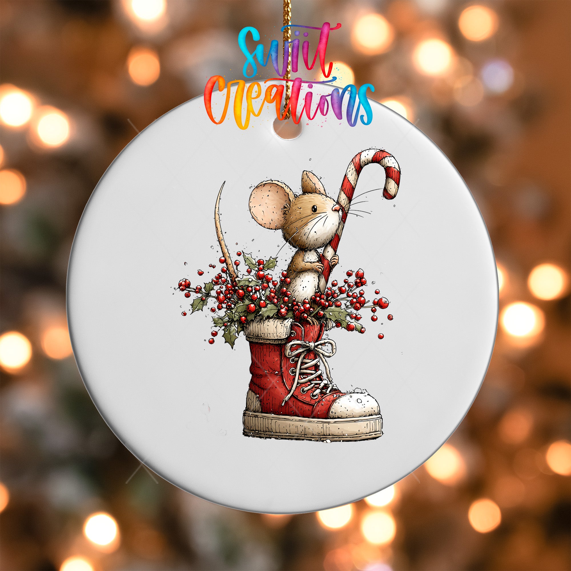A white ornament with a mouse standing in a red and white striped shoe, surrounded by berries and a candy cane.