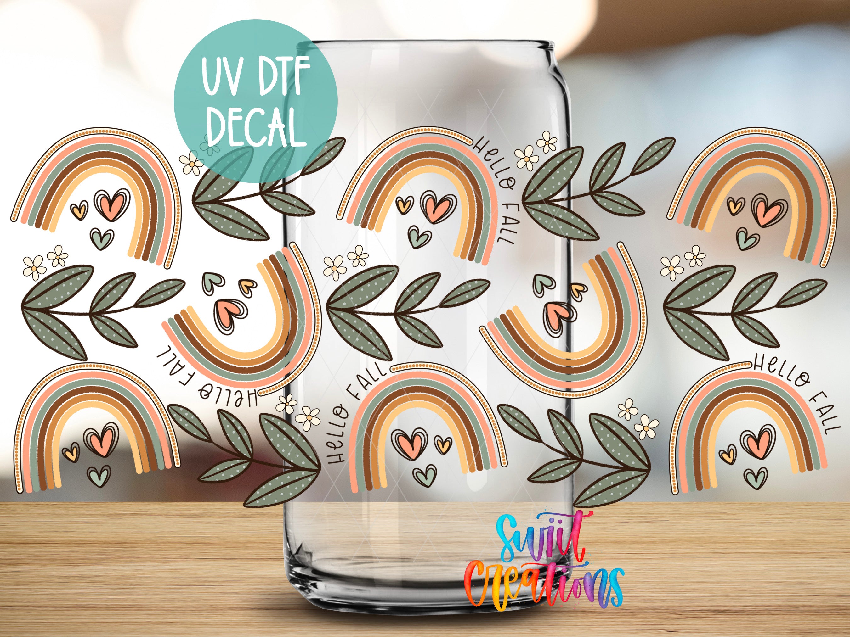 a glass jar with a pattern of colorful rainbows and leaves on it, along with the text "UV Dtf DECAL" and "Hello Fall" written on it.