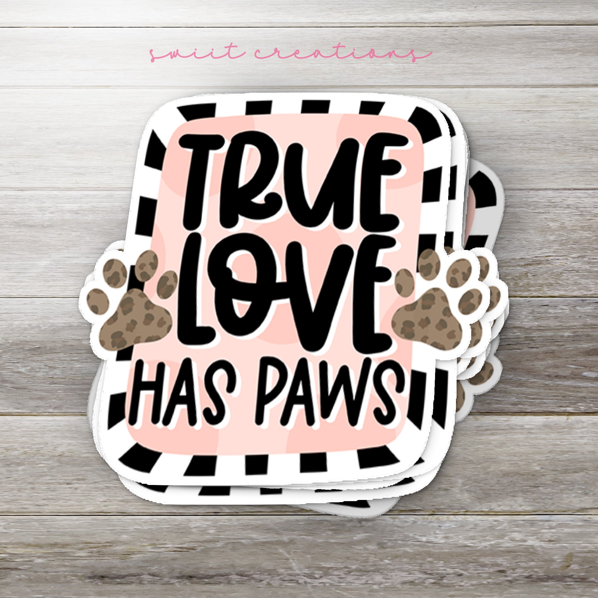 a sticker that says true love has paws