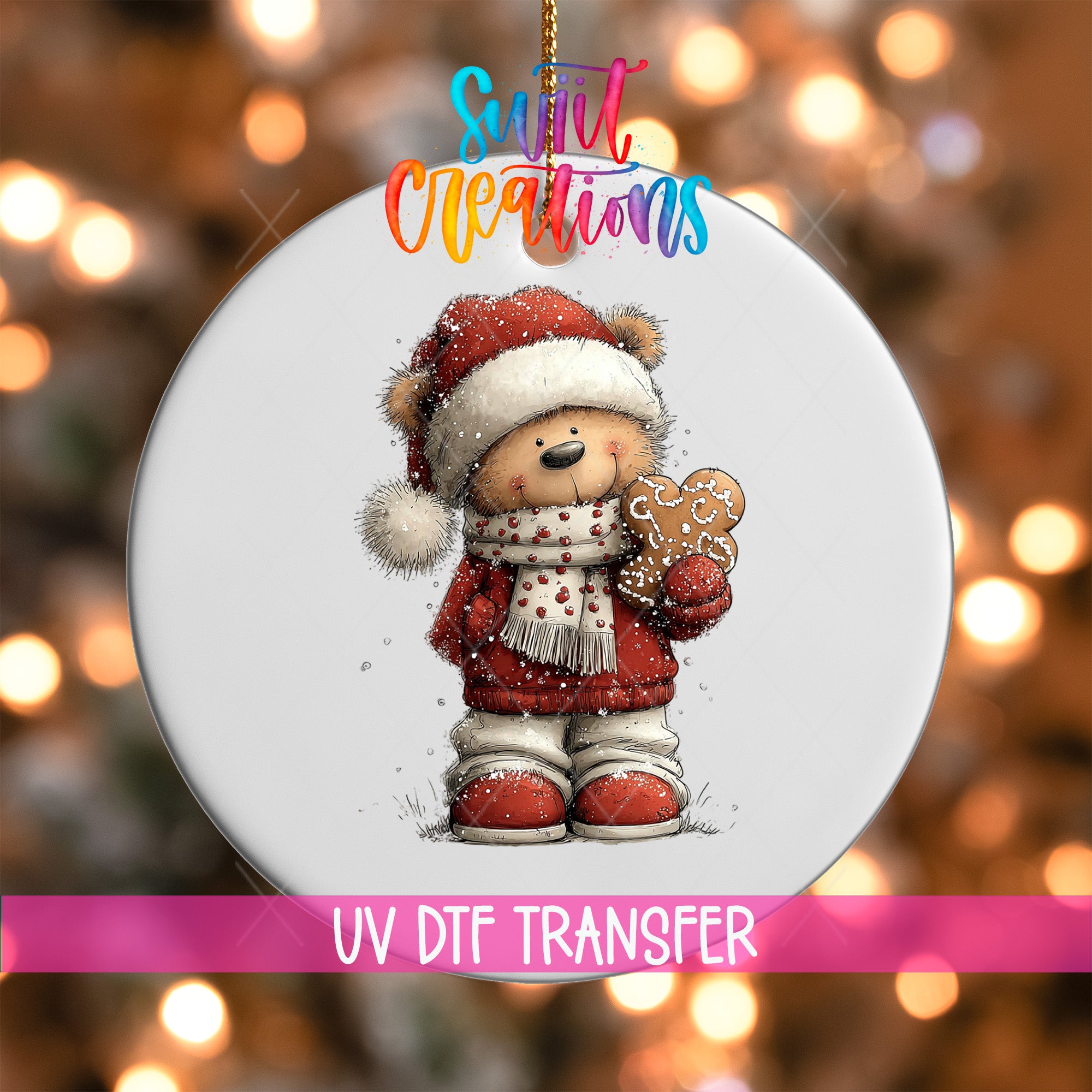 A white ornament with a cartoon image of a teddy bear wearing a Santa hat and holding a gingerbread man.