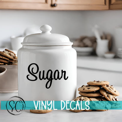 a cookie jar sitting on top of a counter next to cookies