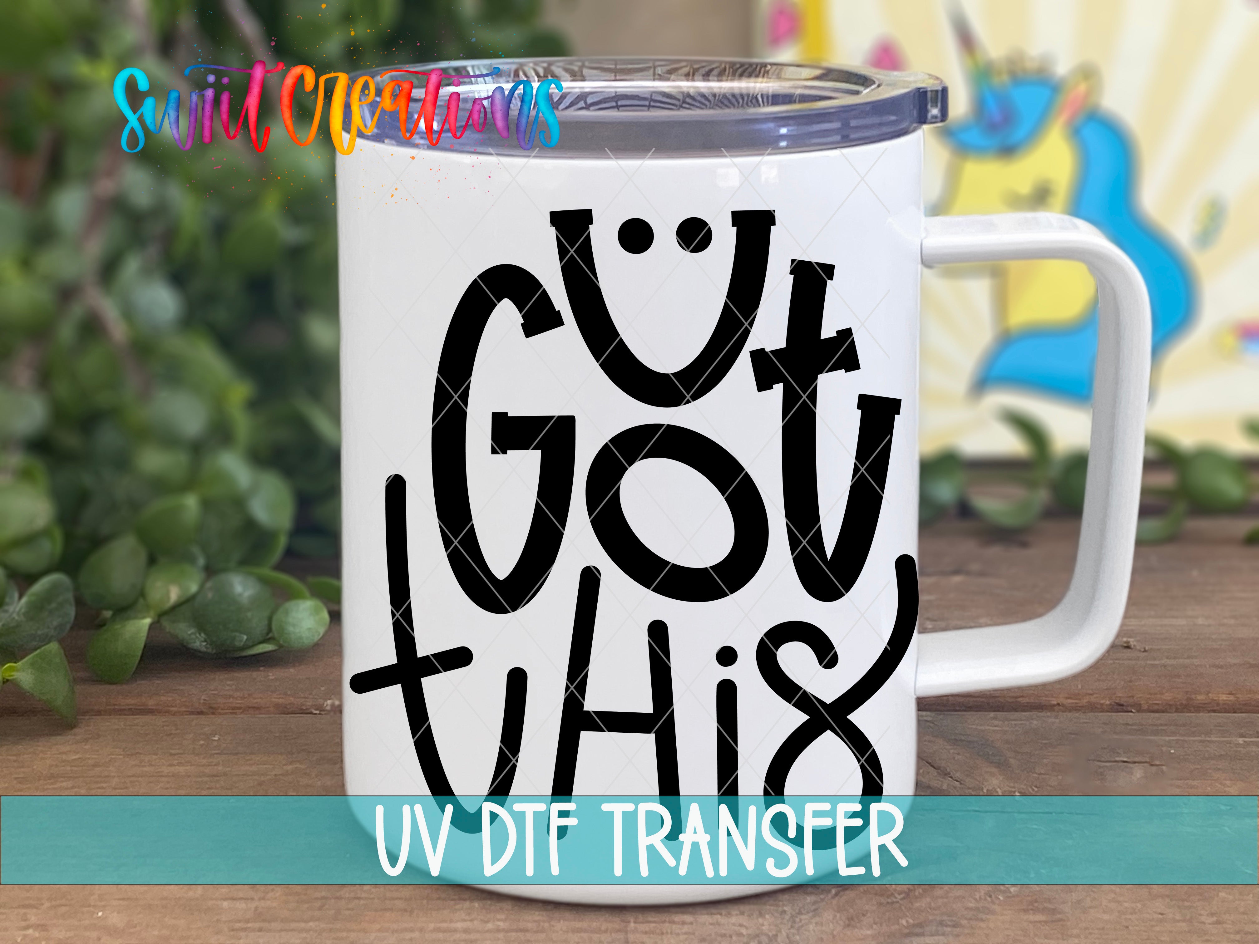A white mug with the text "GUT THIS" printed on it, along with a UV DFT Transfer logo.