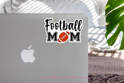 a laptop with a football mom sticker on it