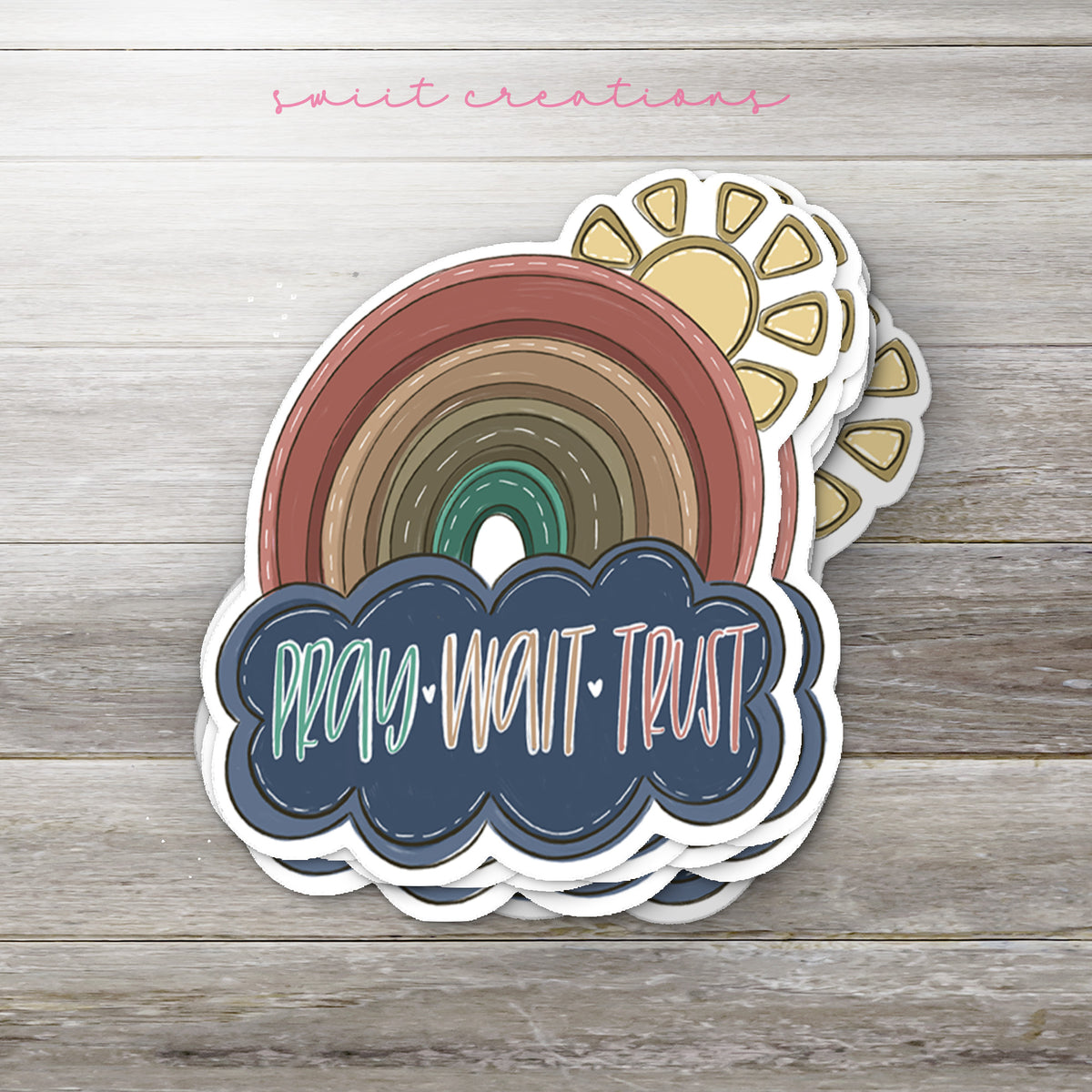 a sticker with a rainbow in the middle of it