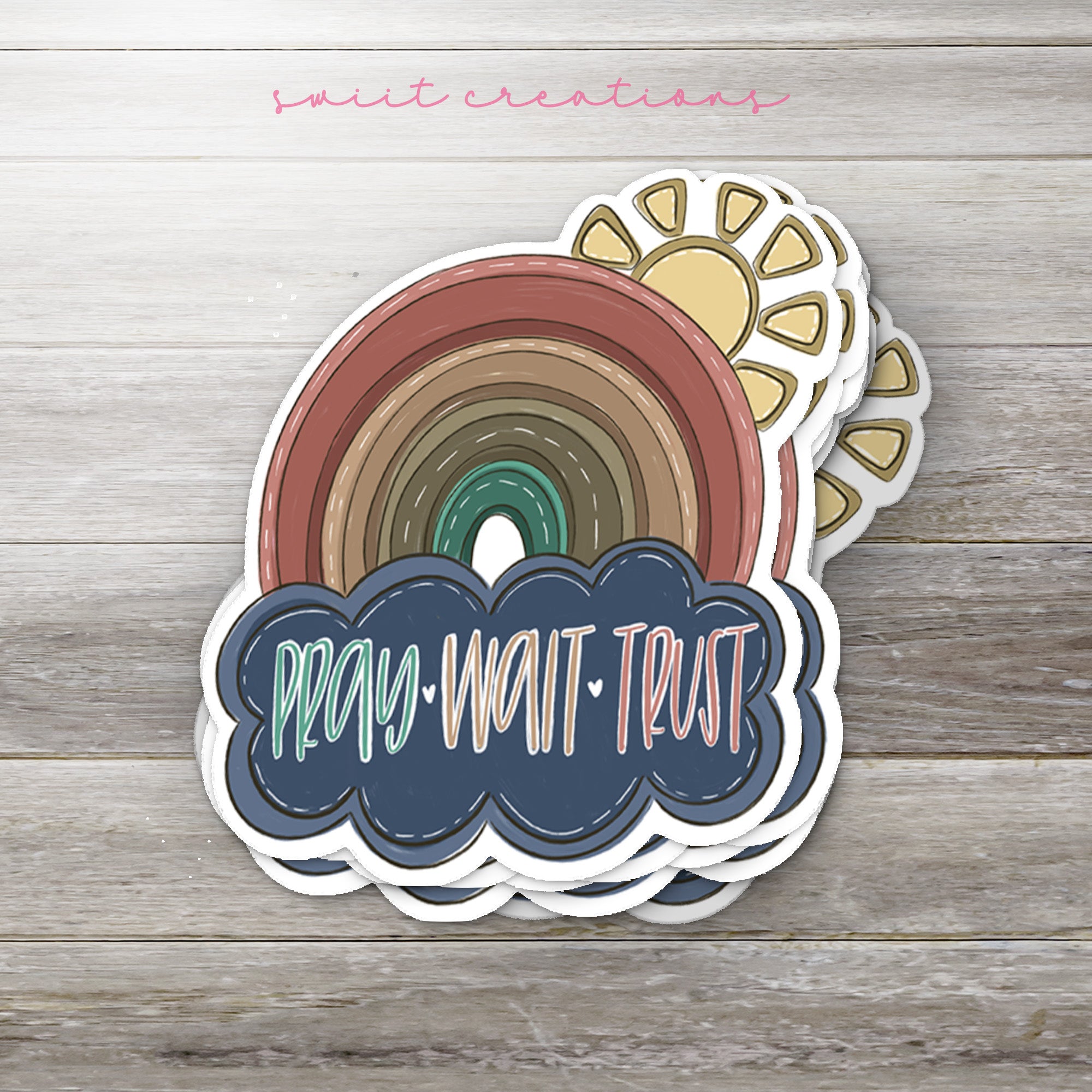 a sticker with a rainbow in the middle of it