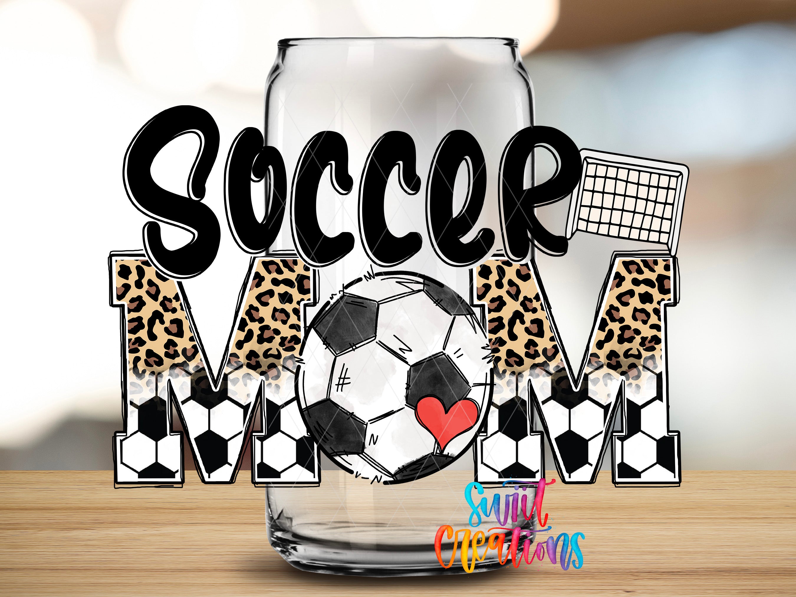 A glass can with the word "SOCCER MOM" written on it, along with a soccer ball and leopard print elements.
