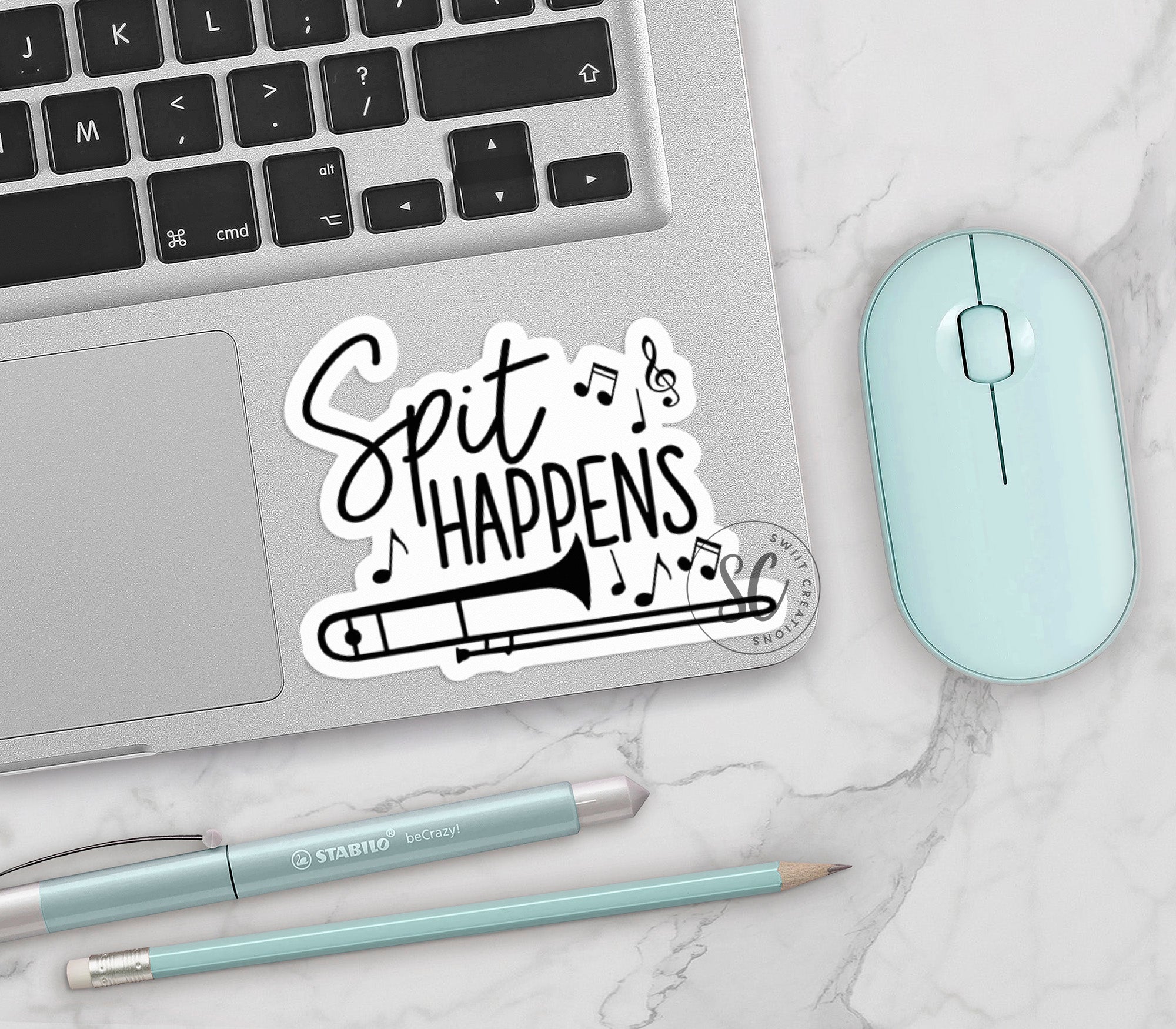 a laptop computer sitting next to a mouse and keyboard