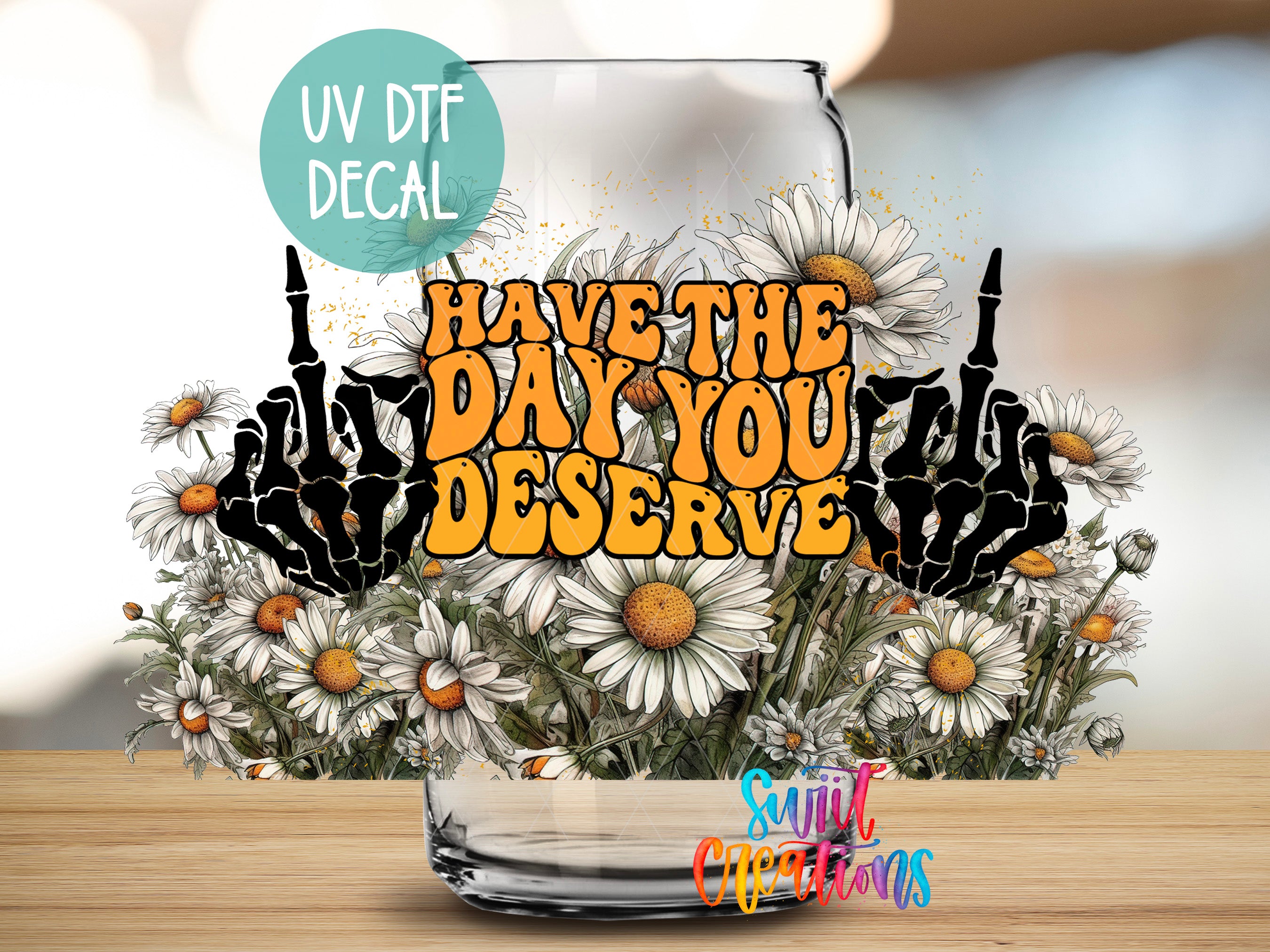 a glass jar filled with flowers, with a message written on it that says "Have the day you deserve".