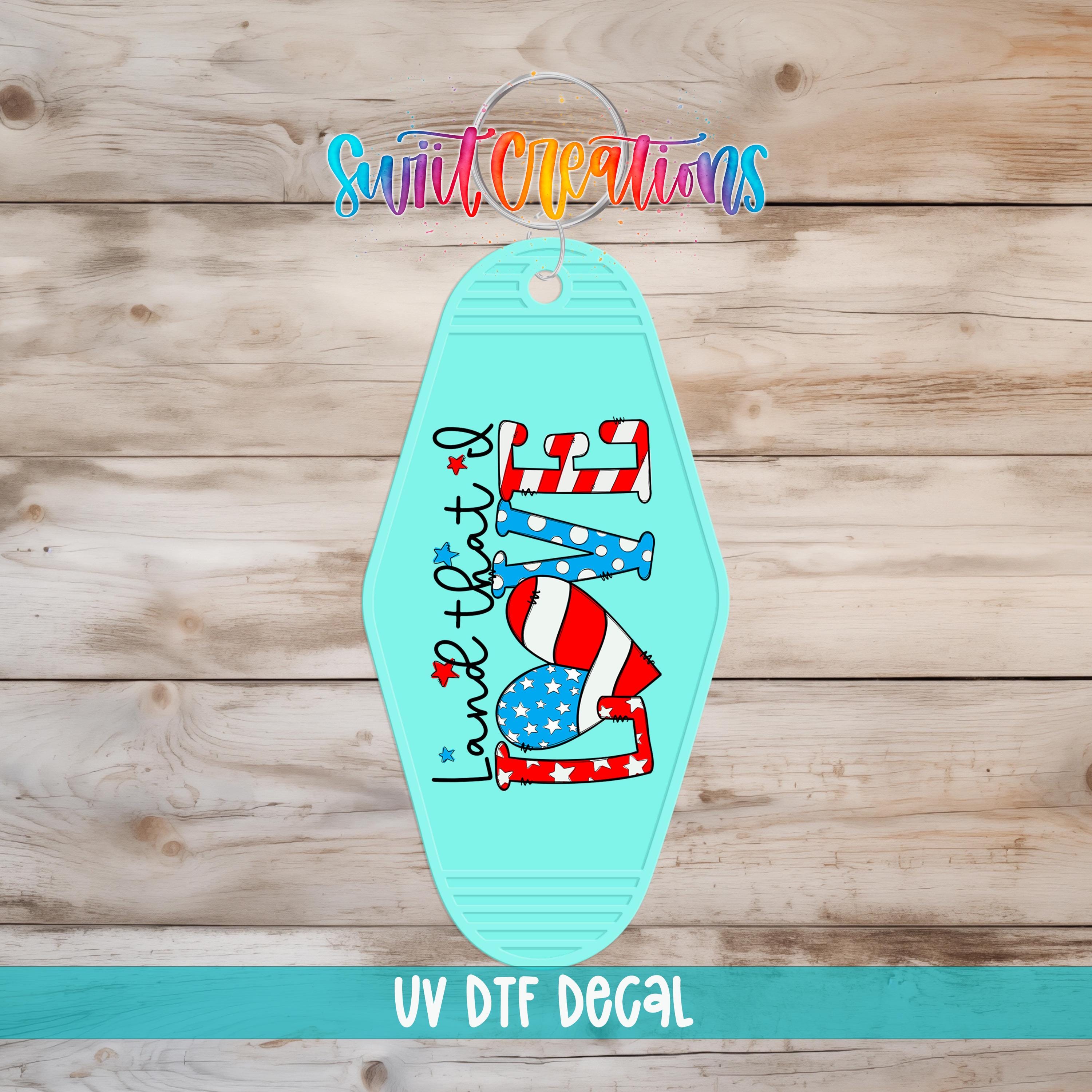 A turquoise keychain with a patriotic design, including an American flag and the text "I love that" in a stylized font.