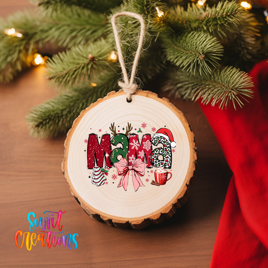 A wooden ornament with the word "Mama" written on it, hanging on a Christmas tree.