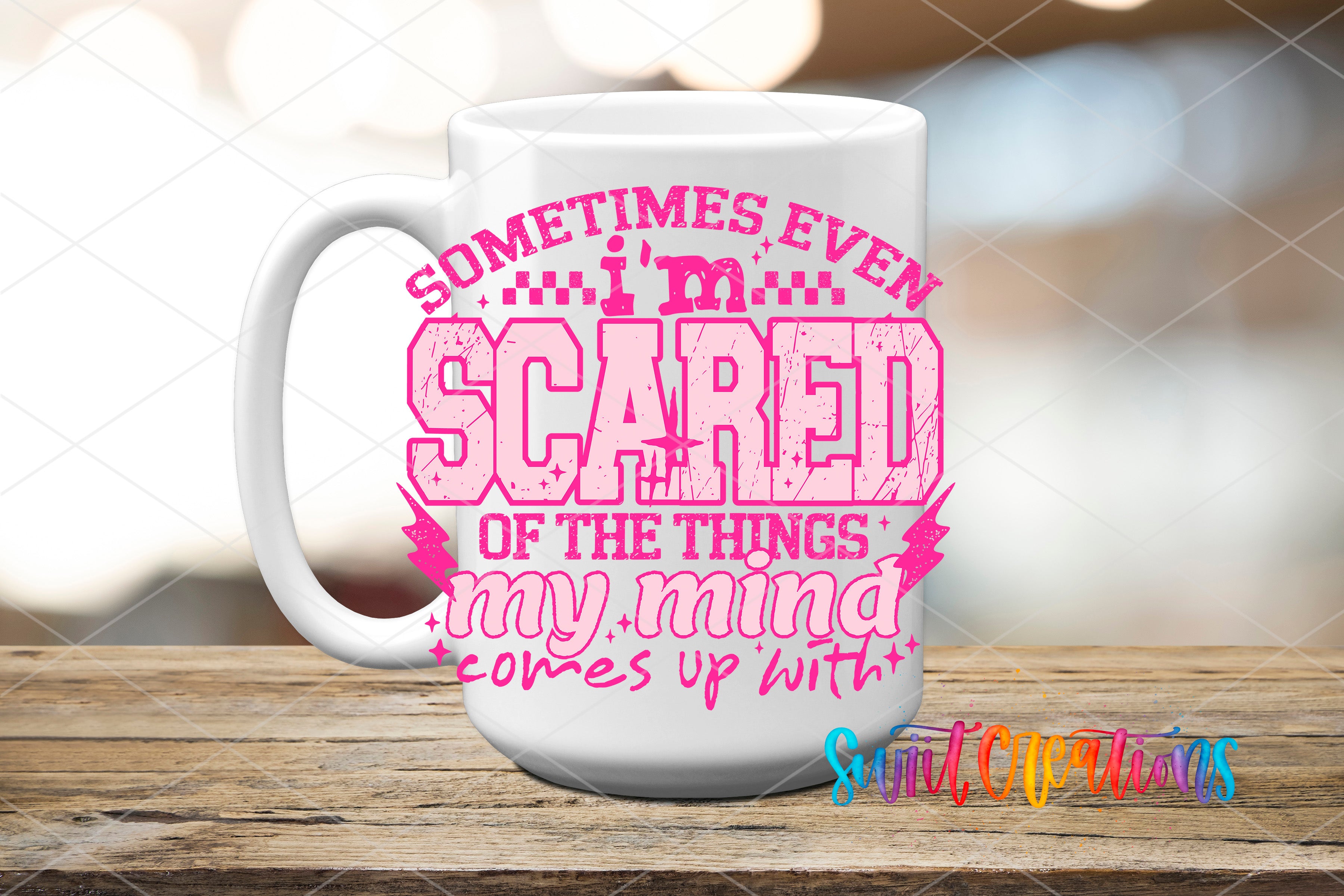 A white mug with a printed design on it, featuring text that says "Sometimes even I'm scared of the things my mind comes up with".